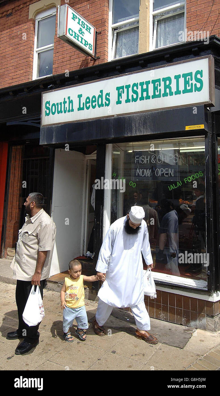 Customers leave the Leeds fish and chip shop owned by Mohammed Tanweer, the father of London suicide bomber Shehzad Tanweer. The Yorkshire family of Britain's first suicide bomber said they could not comprehend why he had become a mass murderer. Shehzad Tanweer, 22, was an outwardly ordinary young British man, a university graduate who studied sports science and loved cricket and football. Stock Photo