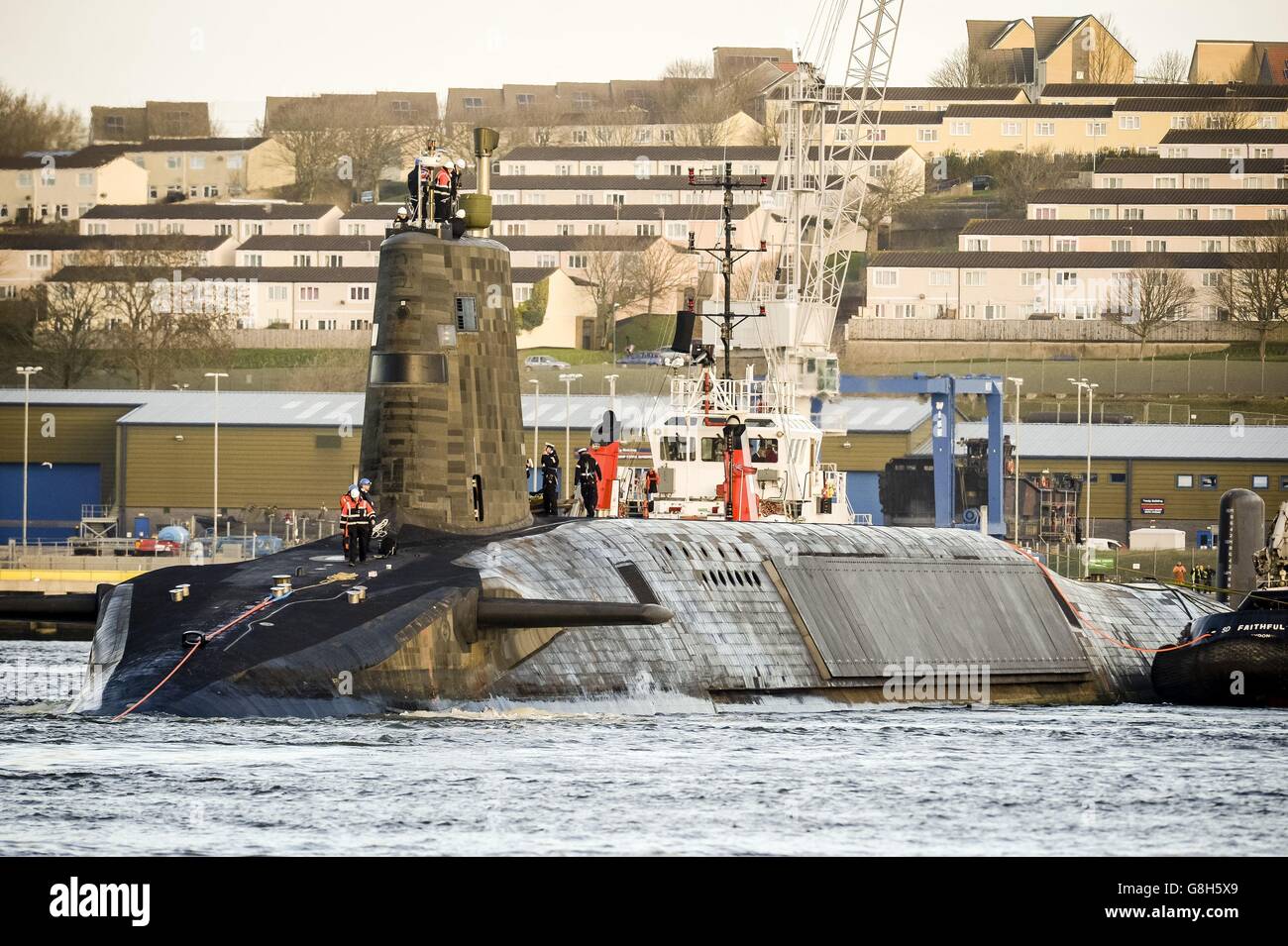 HMS Vengeance is towed out into the sea at Plymouth as the V-Class UK nuclear deterrent submarine sets sail after a &Acirc;&pound;350m refit at HMNB Devonport, Plymouth. Stock Photo