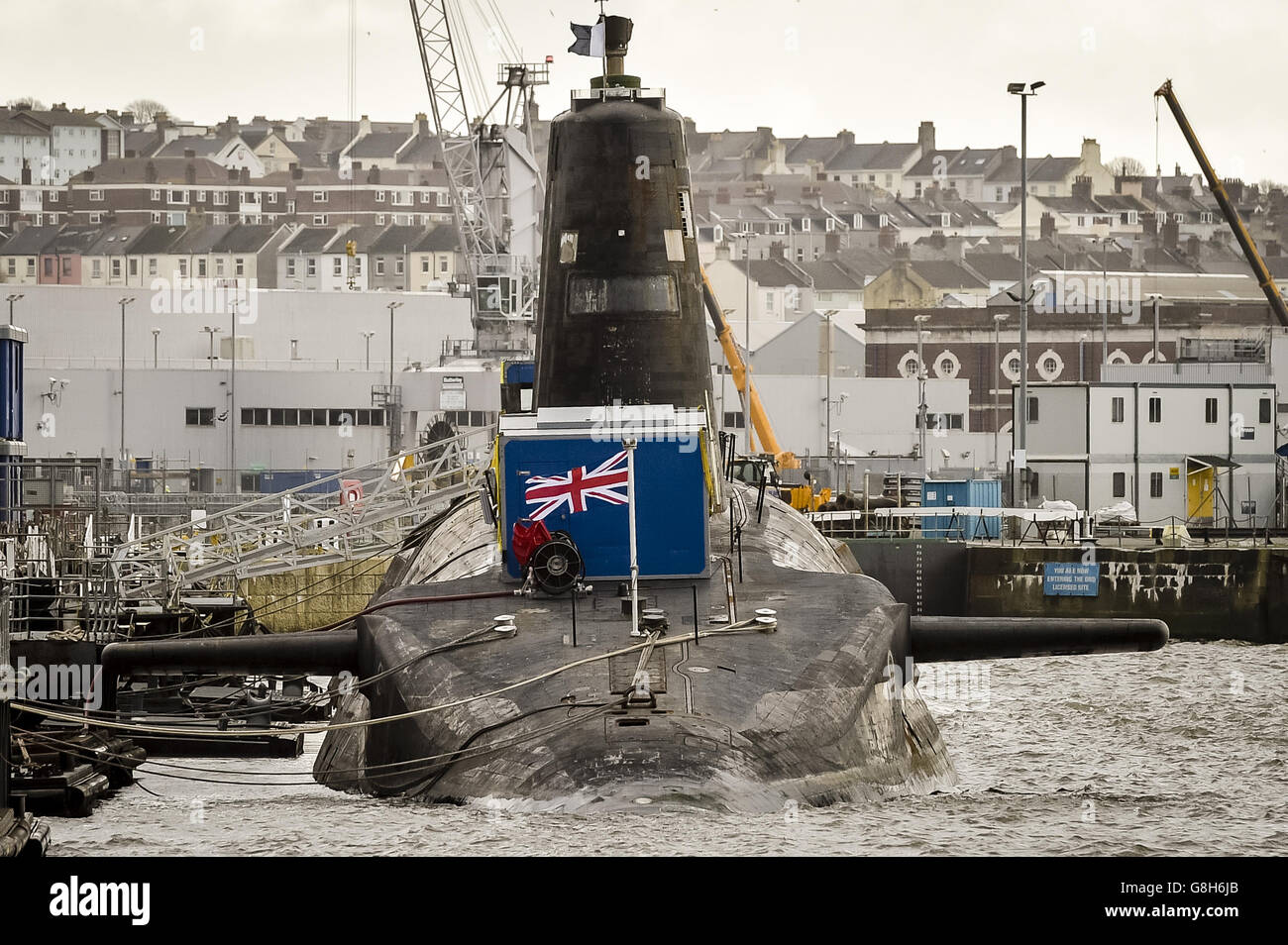 Nuclear submarine refit. HMS Vanguard, the V-Class UK nuclear deterrent submarine docked at Devonport, Plymouth. Stock Photo