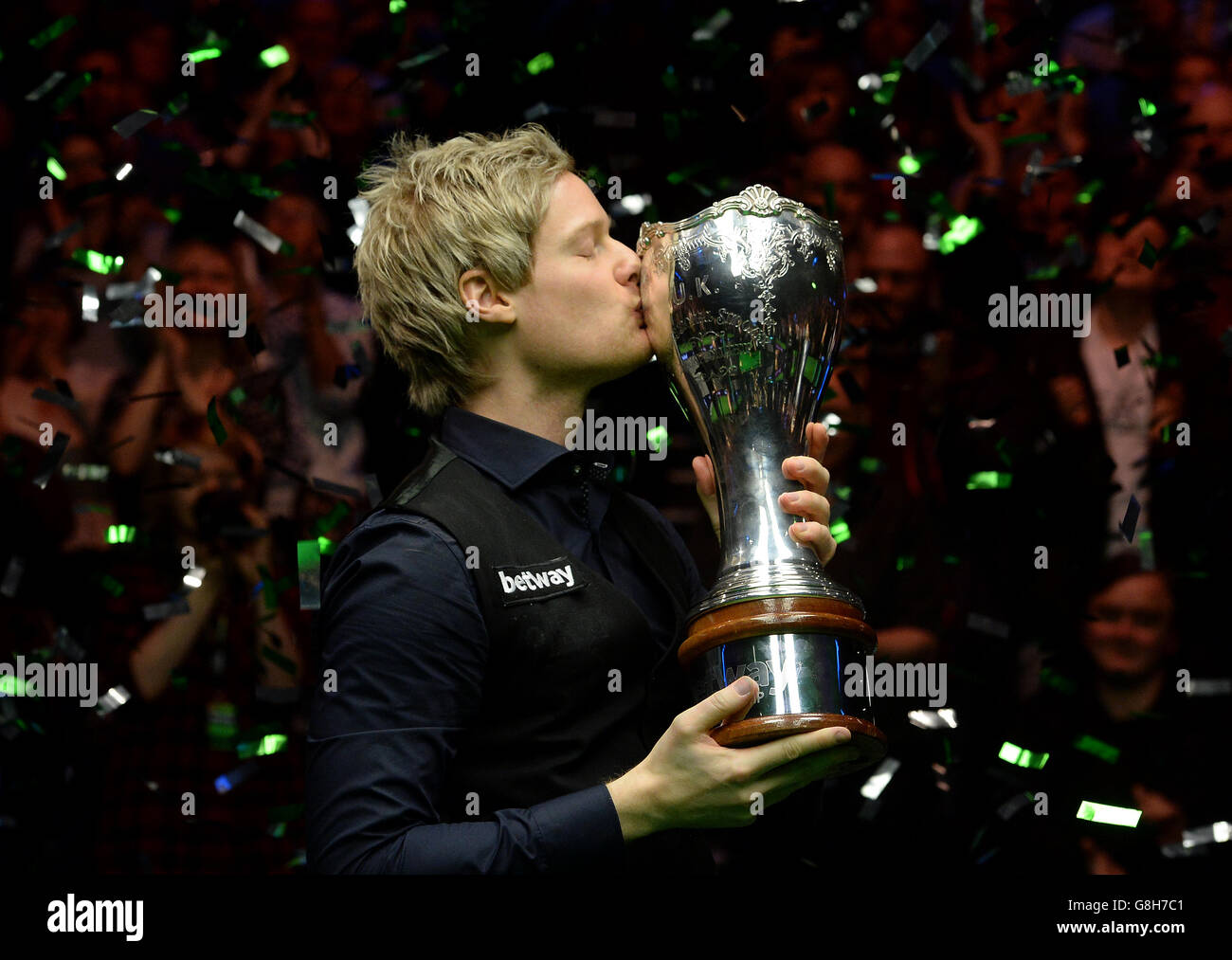 Neil Robertson celebrates with the trophy after winning the final match against Liang Wenbo during day twelve of the 2015 Betway UK Snooker Championship at The York Barbican, York. Stock Photo