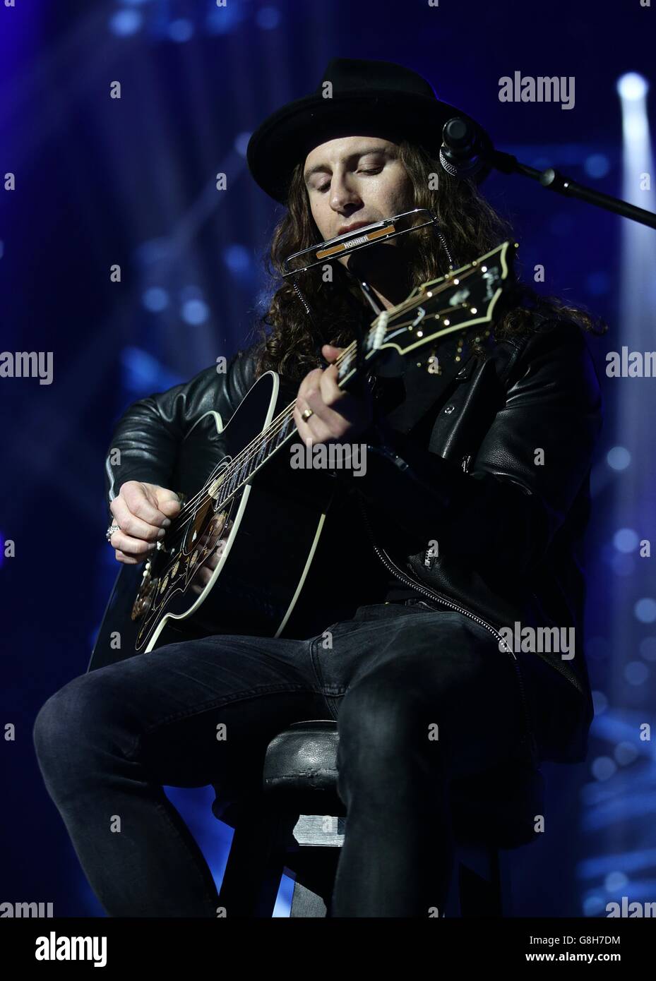 The guitarist performing on stage with Justin Bieber during the Capital