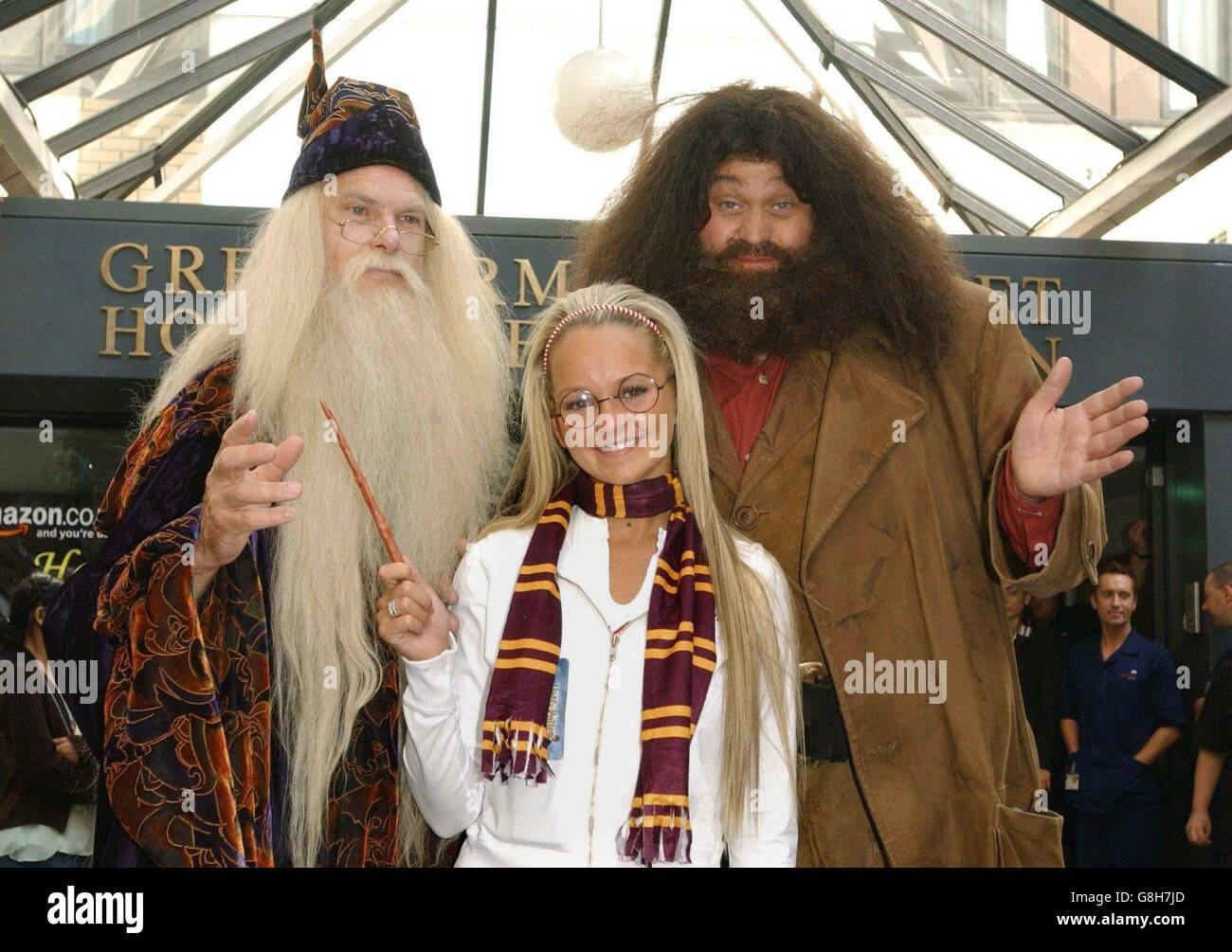 Jennifer Ellison, Hagrid and Professor Dumbledore during a visit to hand out copies of the new Harry Potter book, which was released at midnight. Stock Photo