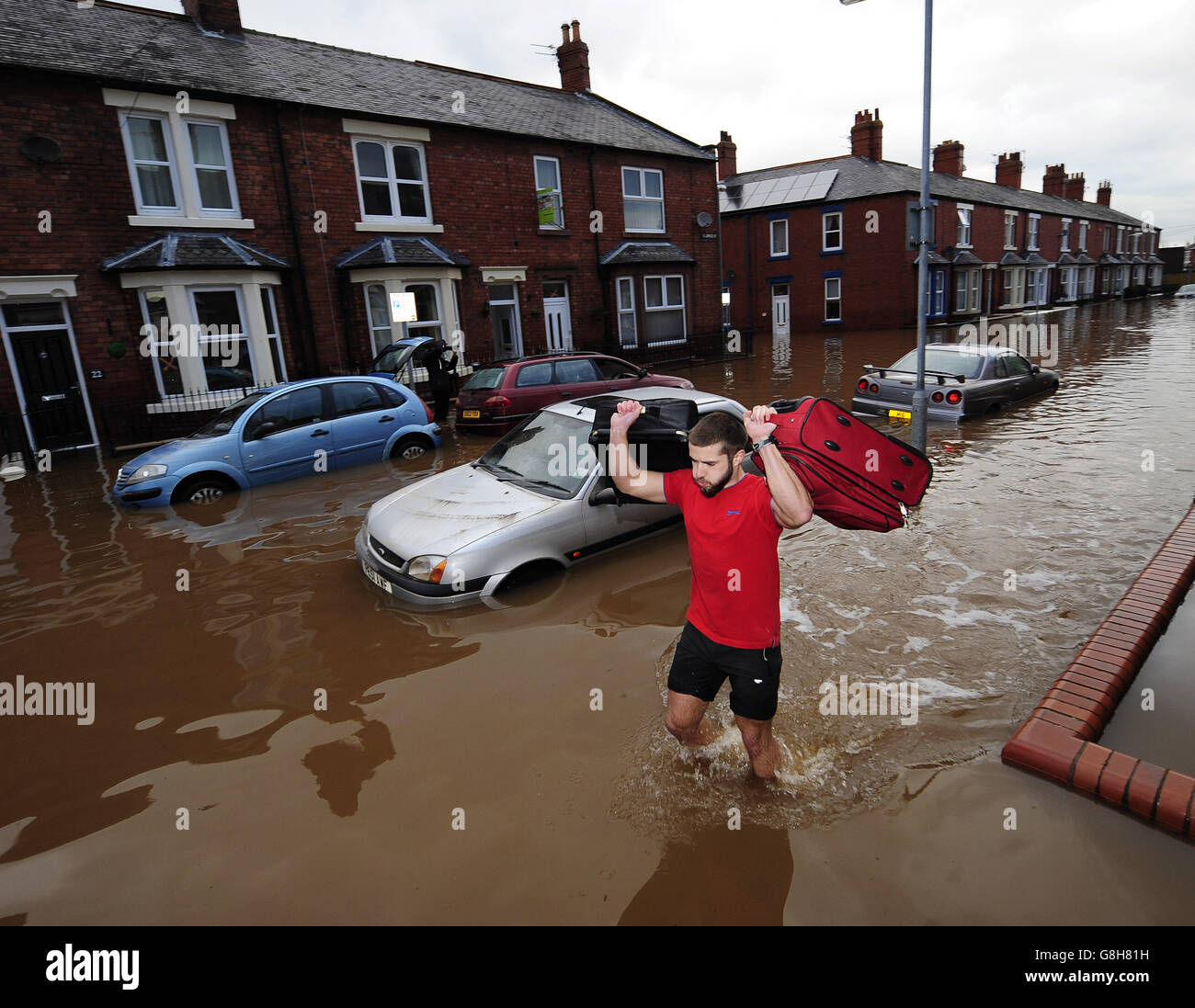 Fire and Rescue teams continue their work to bring people out of flooded homes in Carlisle following heavy rains over he weekend. Stock Photo