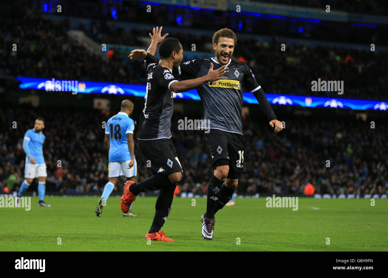 Borussia Monchengladbach's Raffael (left) celebrates with Fabian Johnson after scoring his side's second goal of the game against Manchester City. Stock Photo