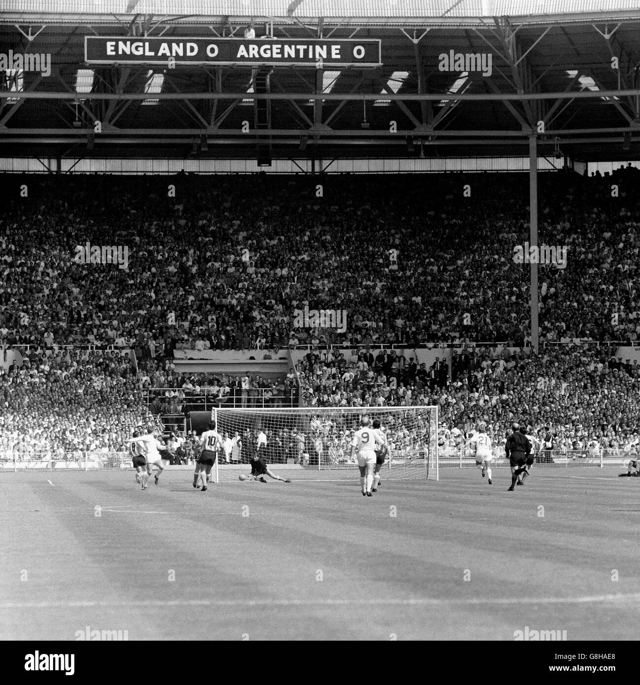 Argentina goalkeeper Antonio Roma (fourth l) saves from England's Geoff Hurst (second l), watched by Argentina's Roberto Ferreiro (l), Antonio Rattin (third l), Alberto Gonzalez (r) and Jorge Solari (fourth r), England's Roger Hunt (third r) and Bobby Charlton (fifth l), and referee Rudolf Kreitlein (second r) Stock Photo