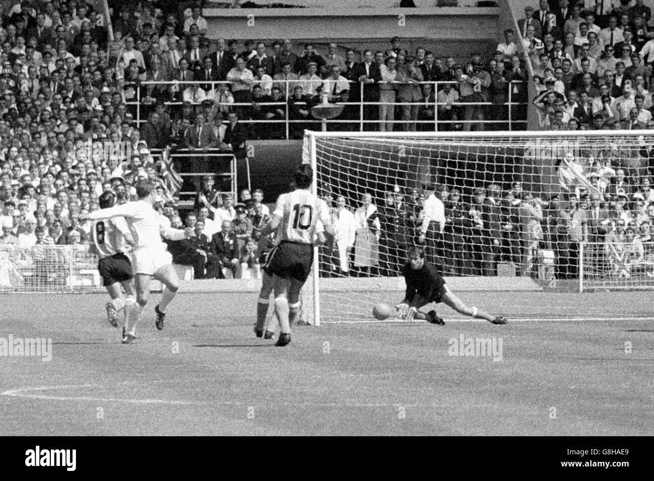 Argentina goalkeeper Antonio Roma (fourth l) saves from England's Geoff Hurst (second l), watched by Argentina's Roberto Ferreiro (l) and Antonio Rattin (third l) Stock Photo
