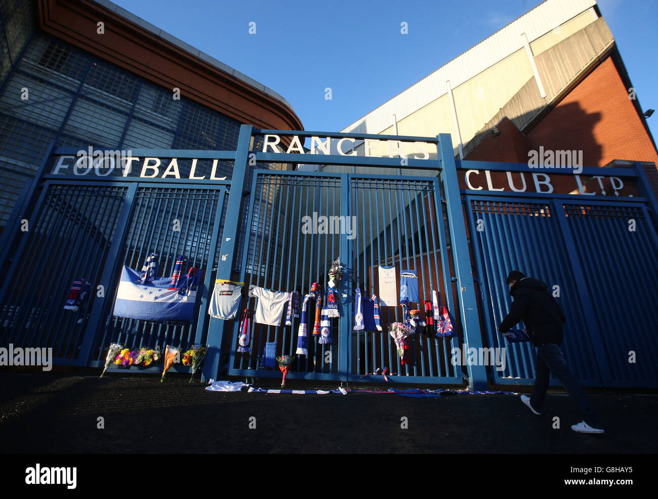 Flags are placed on the gates at Ibrox in memory of former player Arnold Peralta before the Ladbrokes Scottish Championship match between Rangers and Greenock Morton. Stock Photo