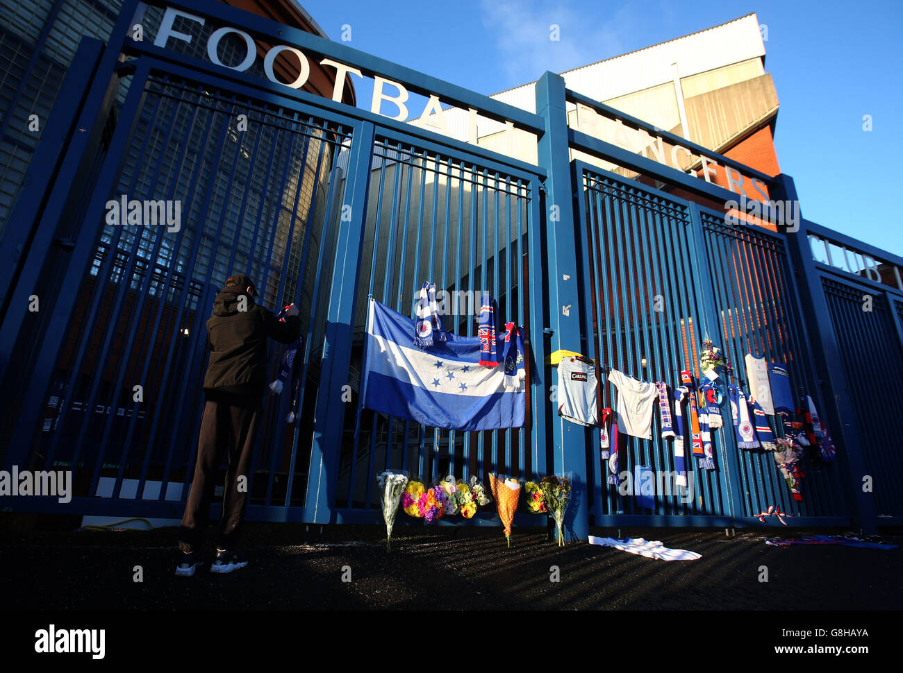 Flags are placed on the gates at Ibrox in memory of former player Arnold Peralta before the Ladbrokes Scottish Championship match between Rangers and Greenock Morton. Stock Photo