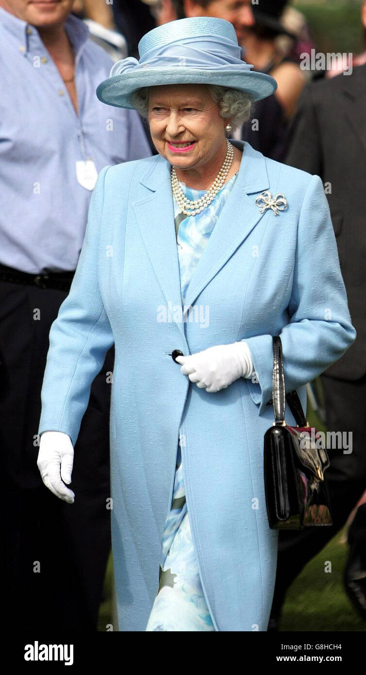 Queen Elizabeth II walks to the winners enclosure for the presentation ...