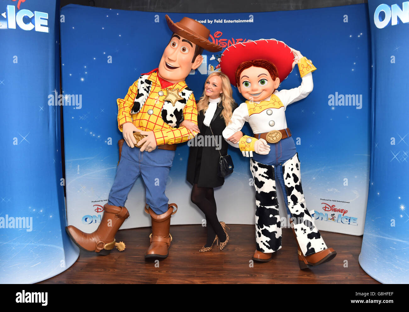 Emma Bunton poses with Woody and Jessie from Toy Story at the opening night of Disney On Ice presents Worlds of Enchantment at the O2 Arena in London. Stock Photo