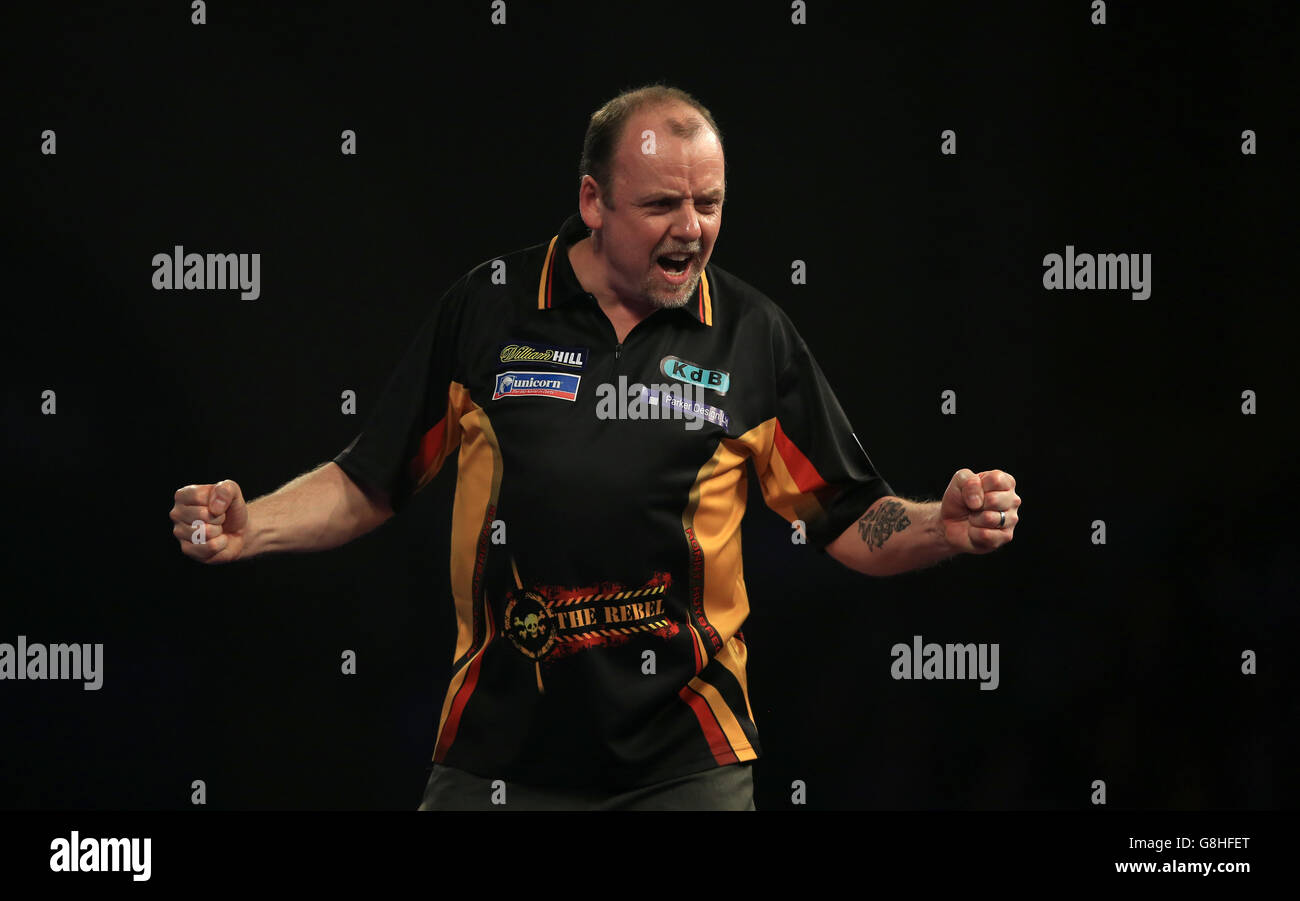 Ronny Huybrechts celebrates on his way to defeating Dean Winstanley during day six of the William Hill PDC World Championship at Alexandra Palace, London. Stock Photo