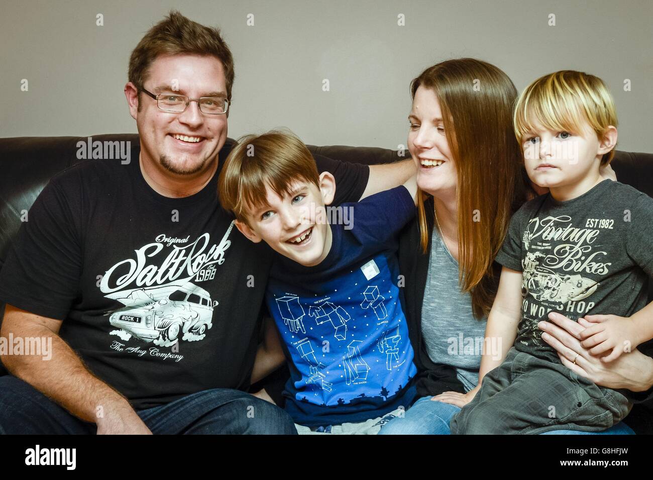 Nathan Crawford, 9, second left, with his younger brother Ned Alison, mother Donna Hunt and stepfather Jonathan Alison at their home in Bude, Cornwall. The nine-year-old with a brain tumour has become the first in the UK to have testicular tissue frozen with the hope he can have children later in life. Stock Photo