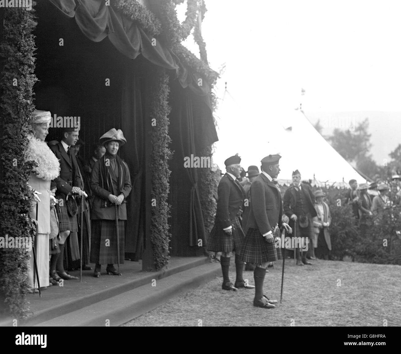 King George V and the Duke of Connaught watch the march past at the Braemar Gathering. Stock Photo