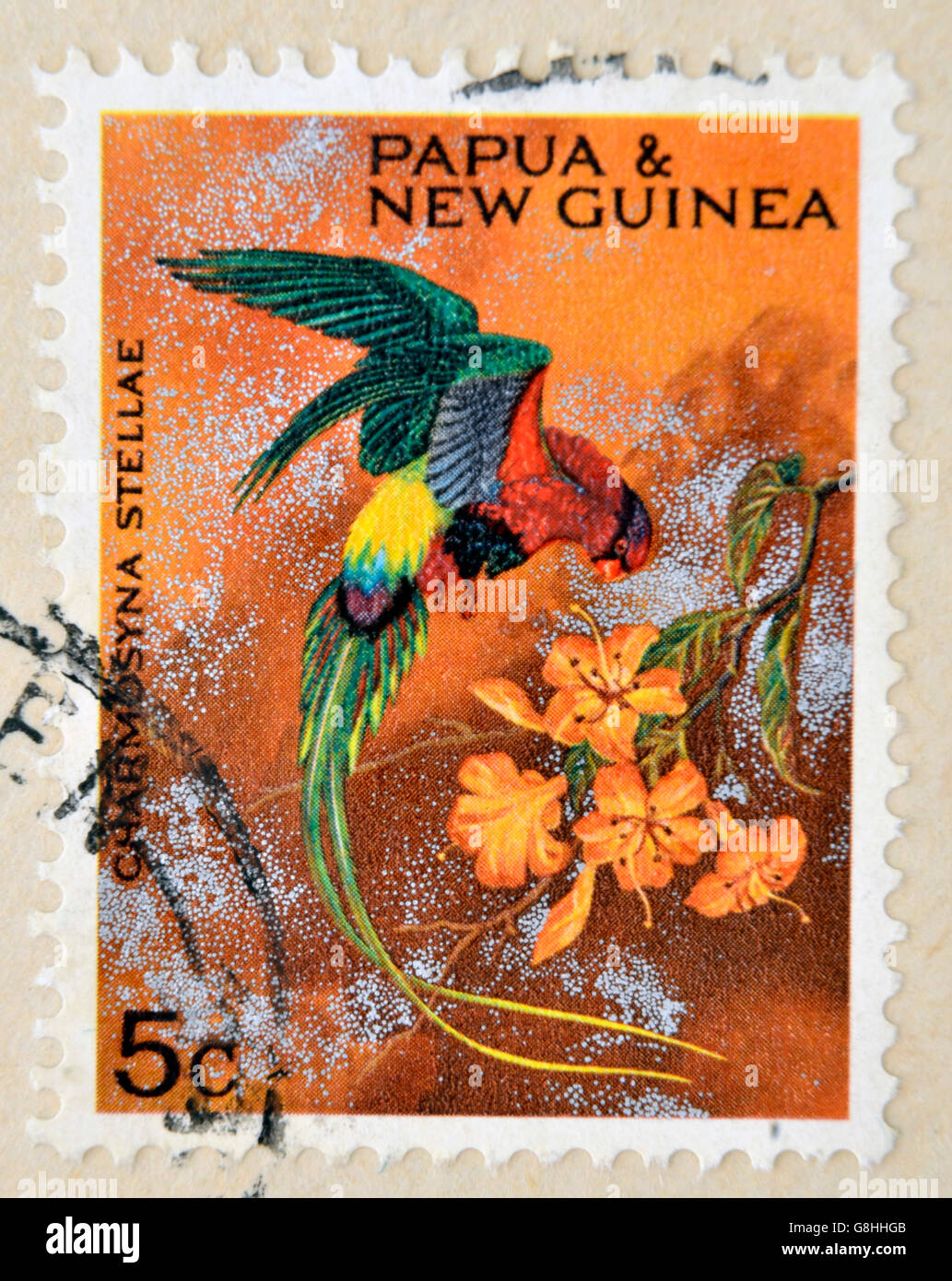 PAPUA NEW GUINEA - CIRCA 1990: A stamp printed in Papua shows bird, charmosyna stellae, circa 1990 Stock Photo