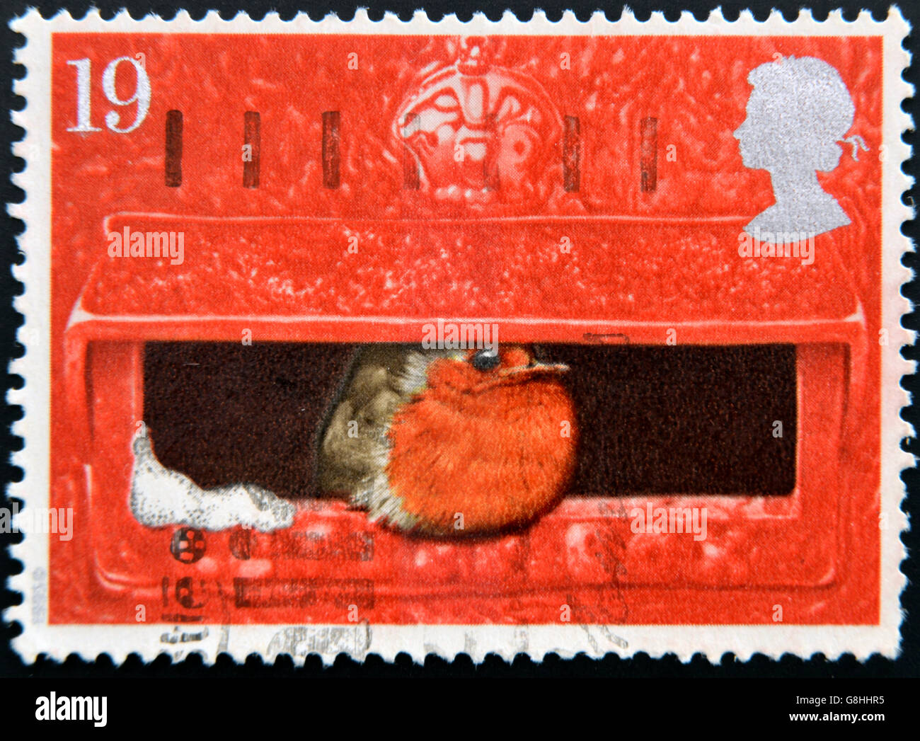 UNITED KINGDOM - CIRCA 1996: a stamp printed in Great Britain shows image of a robin sitting in a postbox, circa 1996 Stock Photo