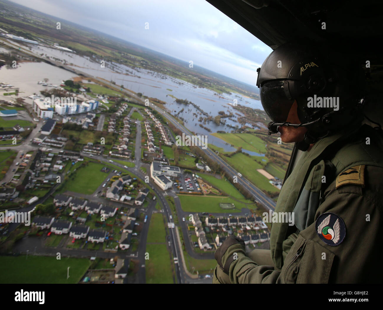 Irish Air Corp Airman Craic Cullen looks out over floods in Athlone Co Westmeath as waters along the river Shannon are expected to exceed severe flood levels with up to 80mm of rain forecast to hit already devastated counties this weekend. Stock Photo