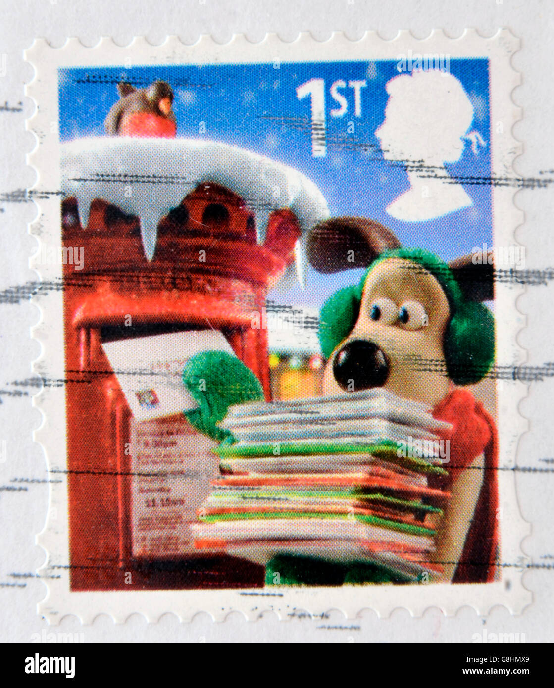UNITED KINGDOM - CIRCA 2010: a  stamp printed in Great Britain shows image of Gromit posting Christmas cards, circa 2010 Stock Photo