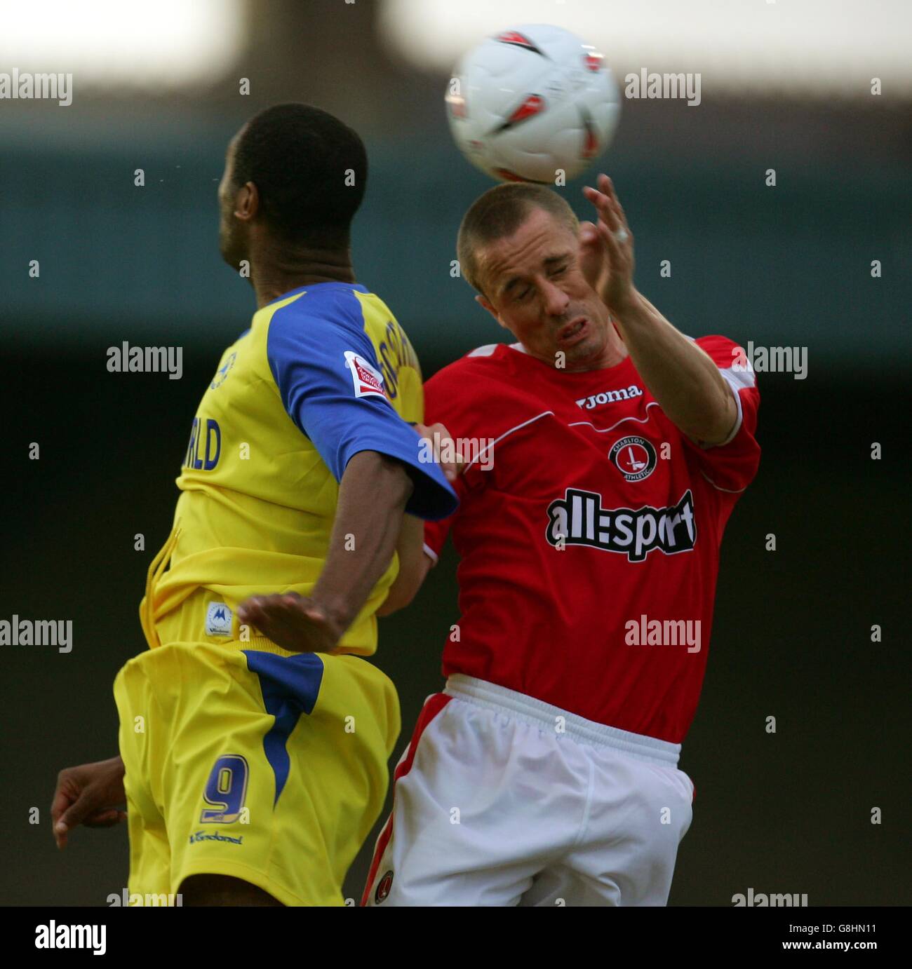 Soccer - Friendly - Torquay United v Charlton Athletic - Plainmoor. Torquay United's Leon Constantine and Charlton Athletic's Chris Perry Stock Photo