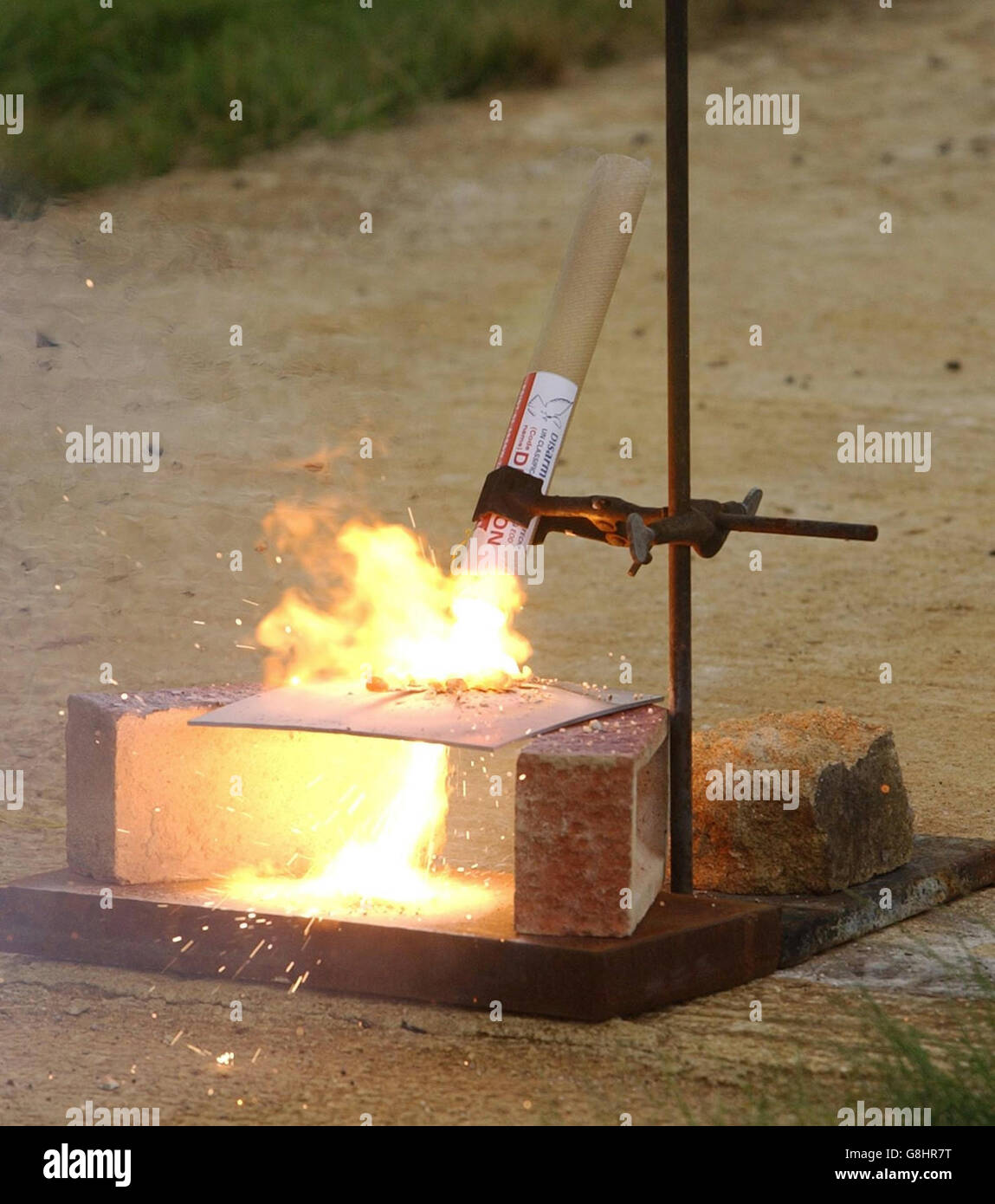 A 'Dragon' burns through a piece of steel plate during a demonstration. A simple new method for clearing landmines without using dangerous and potentially lethal explosives was unveiled today by a team of British scientists from Cranfield University, in Oxfordshire. The 'dragon' device 'burns out' rather than explodes landmines, which is the method currently favoured by the UN. Stock Photo