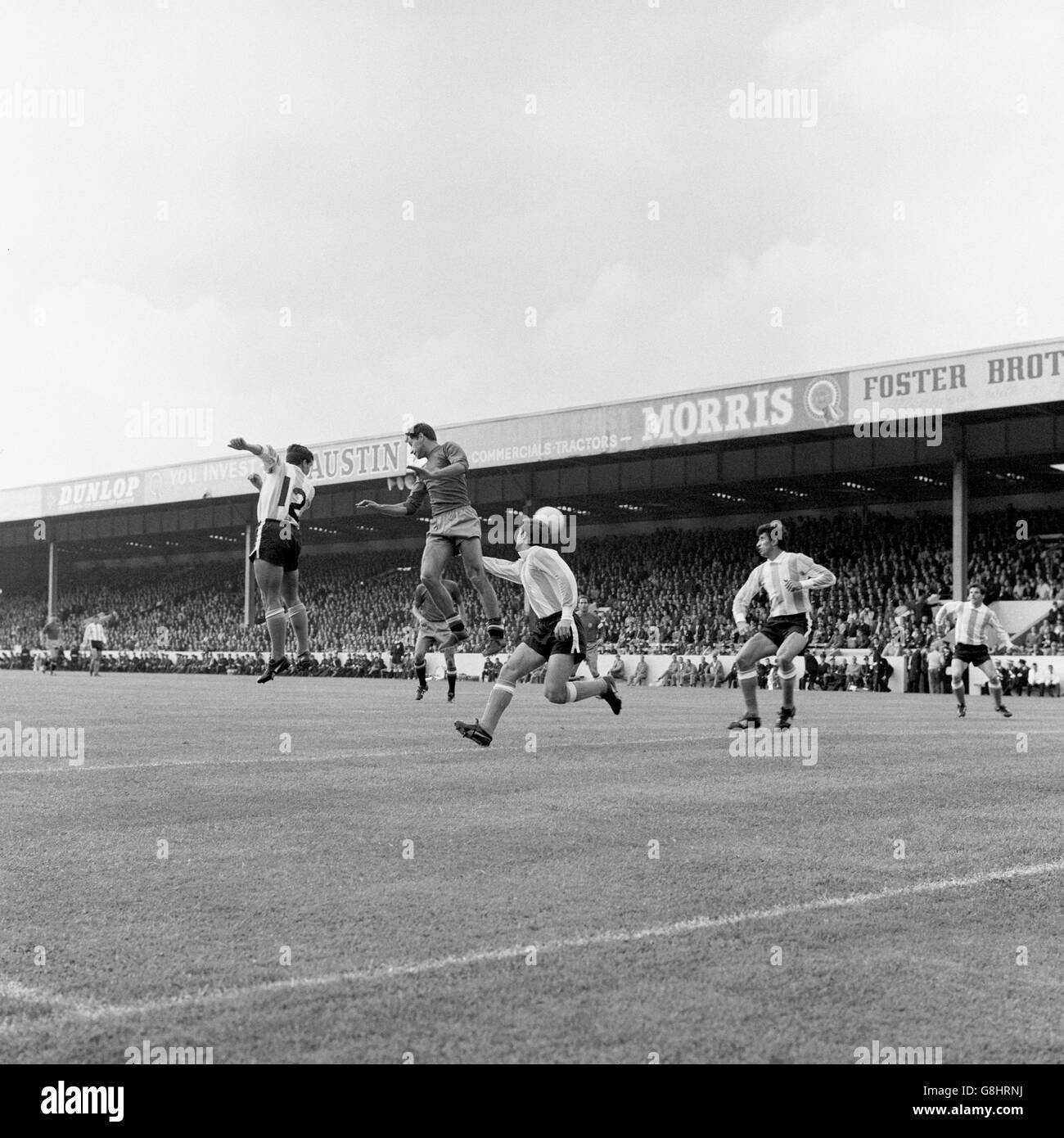Soccer - World Cup England 1966 - Group Two - Spain v Argentina - Villa Park. Argentina's Jorge Albrecht (l), Roberto Perfumo (second r) and Antonio Rattin (r) are deceived by a Spanish cross Stock Photo