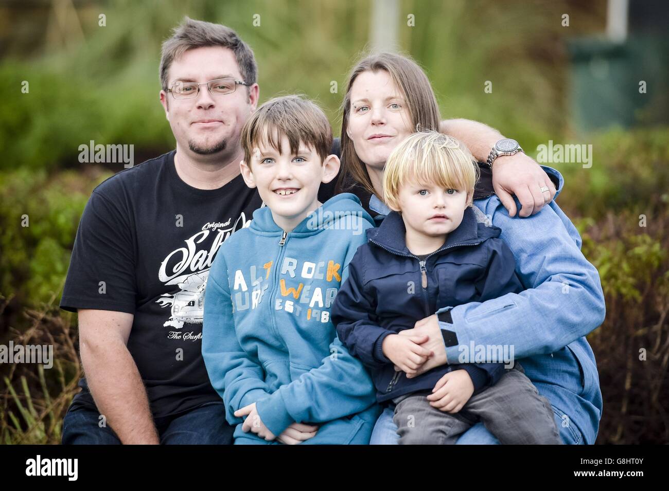 Nathan Crawford, 9, second left, with his younger brother Ned Alison, mother Donna Hunt and stepfather Jonathan Alison near their home in Bude, Cornwall. The nine-year-old with a brain tumour has become the first in the UK to have testicular tissue frozen with the hope he can have children later in life. Stock Photo