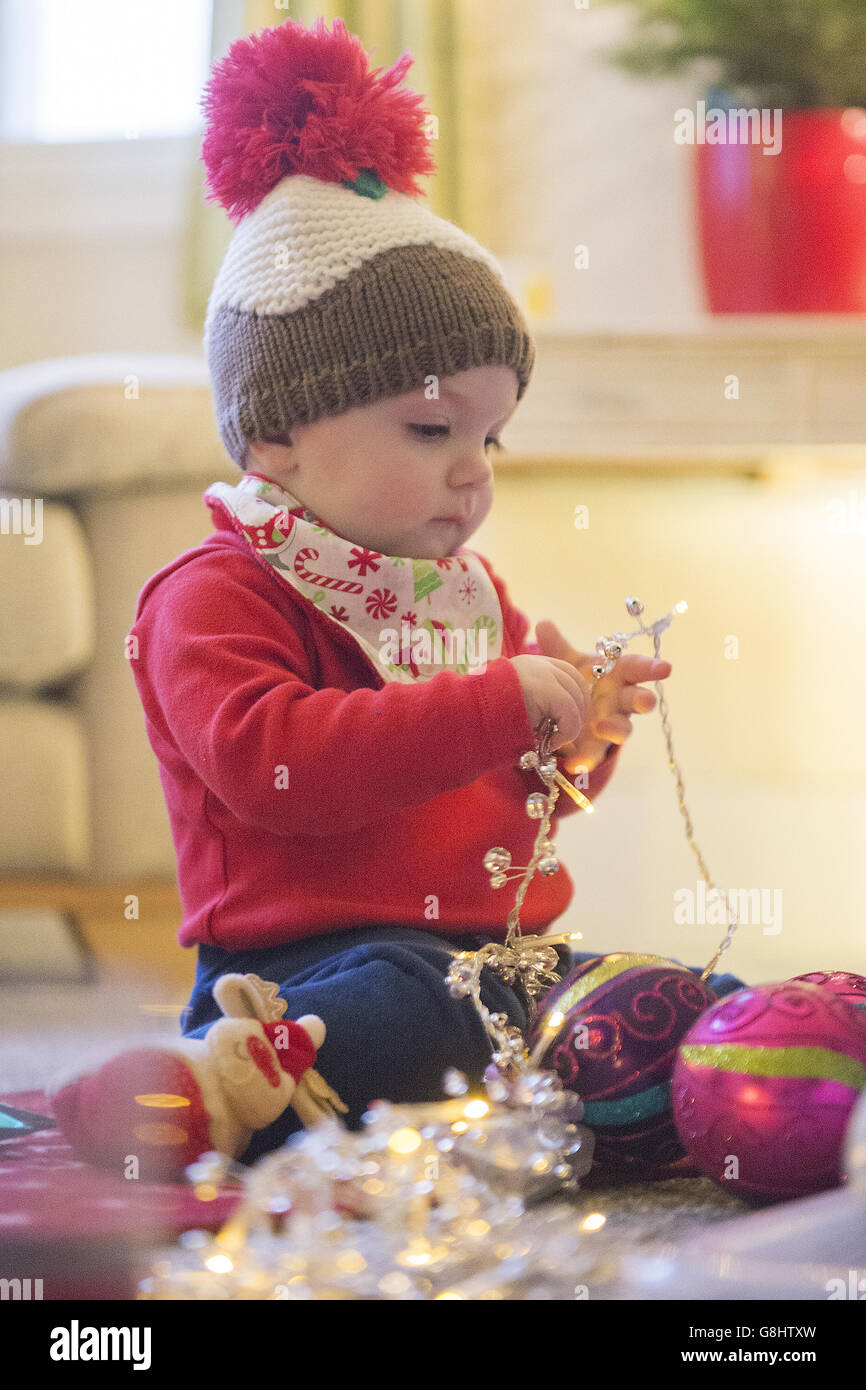 10monthold Charlotte Rose holds Christmas fairy lights, London PRESS
