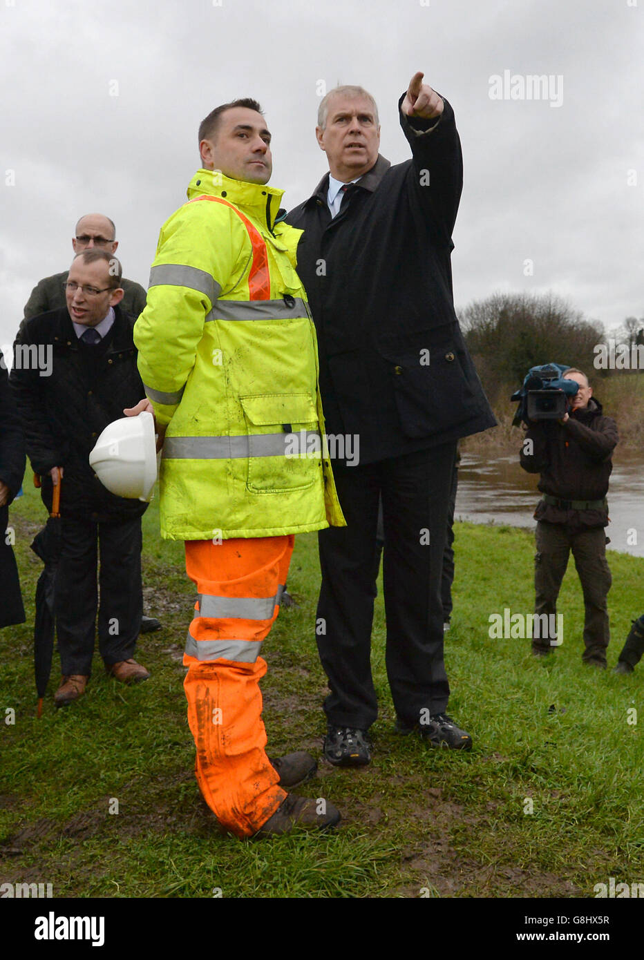 The Duke of York talks to Andrew Wood, Senior Engineer with North Yorkshire County Council, as they look at the damaged bridge over the River Wharfe in Tadcaster, during his visit to the area to view flood damage. Stock Photo