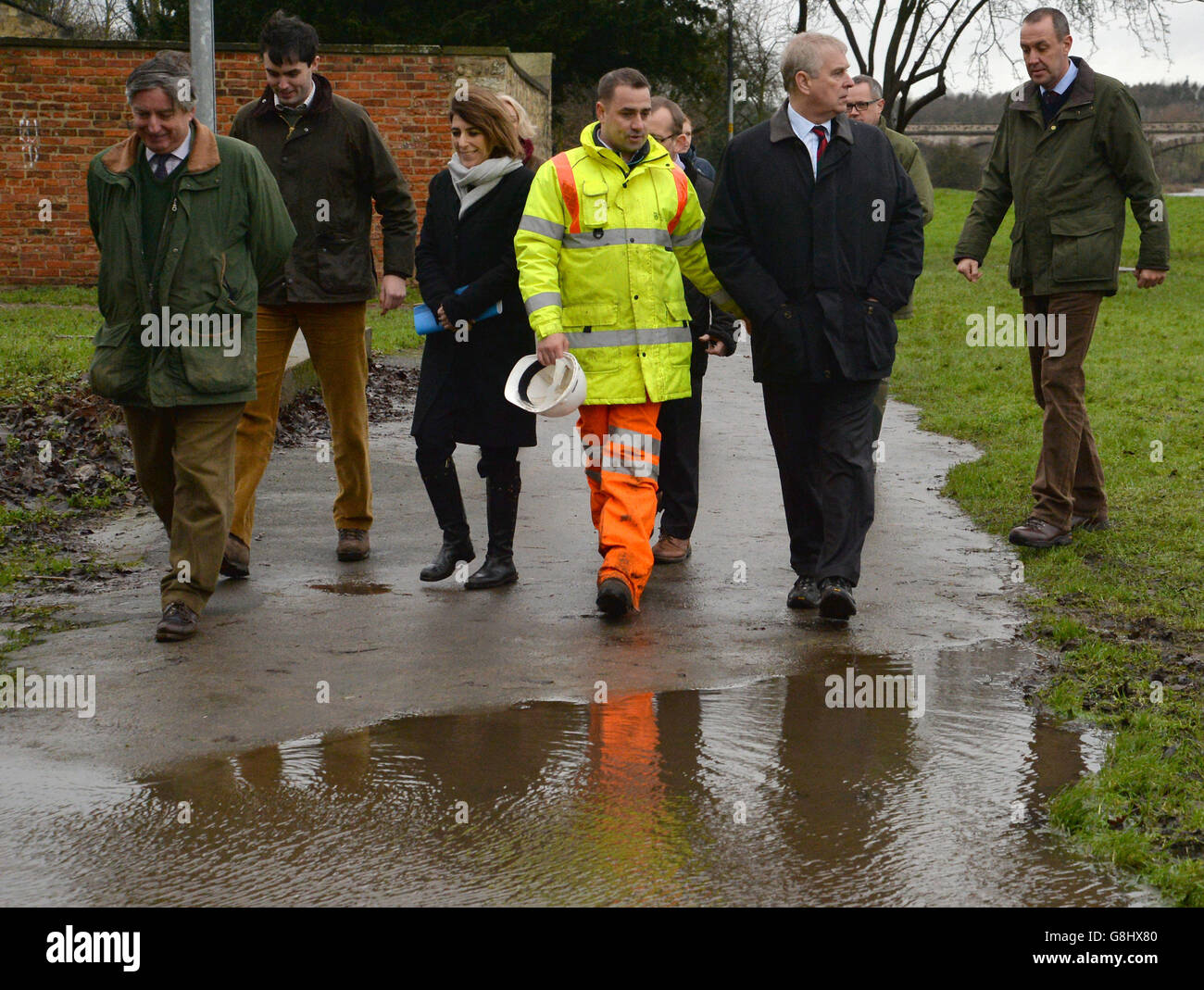The Duke of York talks to Andrew Wood, Senior Engineer with North Yorkshire County Council, as they walk along the footpath close to the River Wharfe in Tadcaster, during his visit to the area to view flood damage. Stock Photo