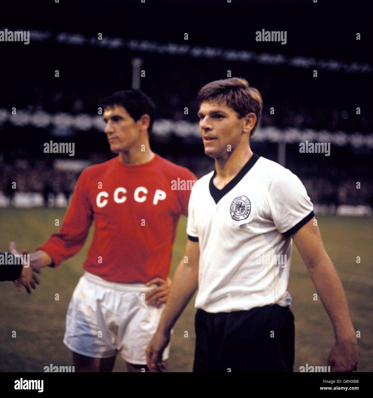 West Germany's Wolfgang Weber (r) looks quietly satisfied with reaching ...