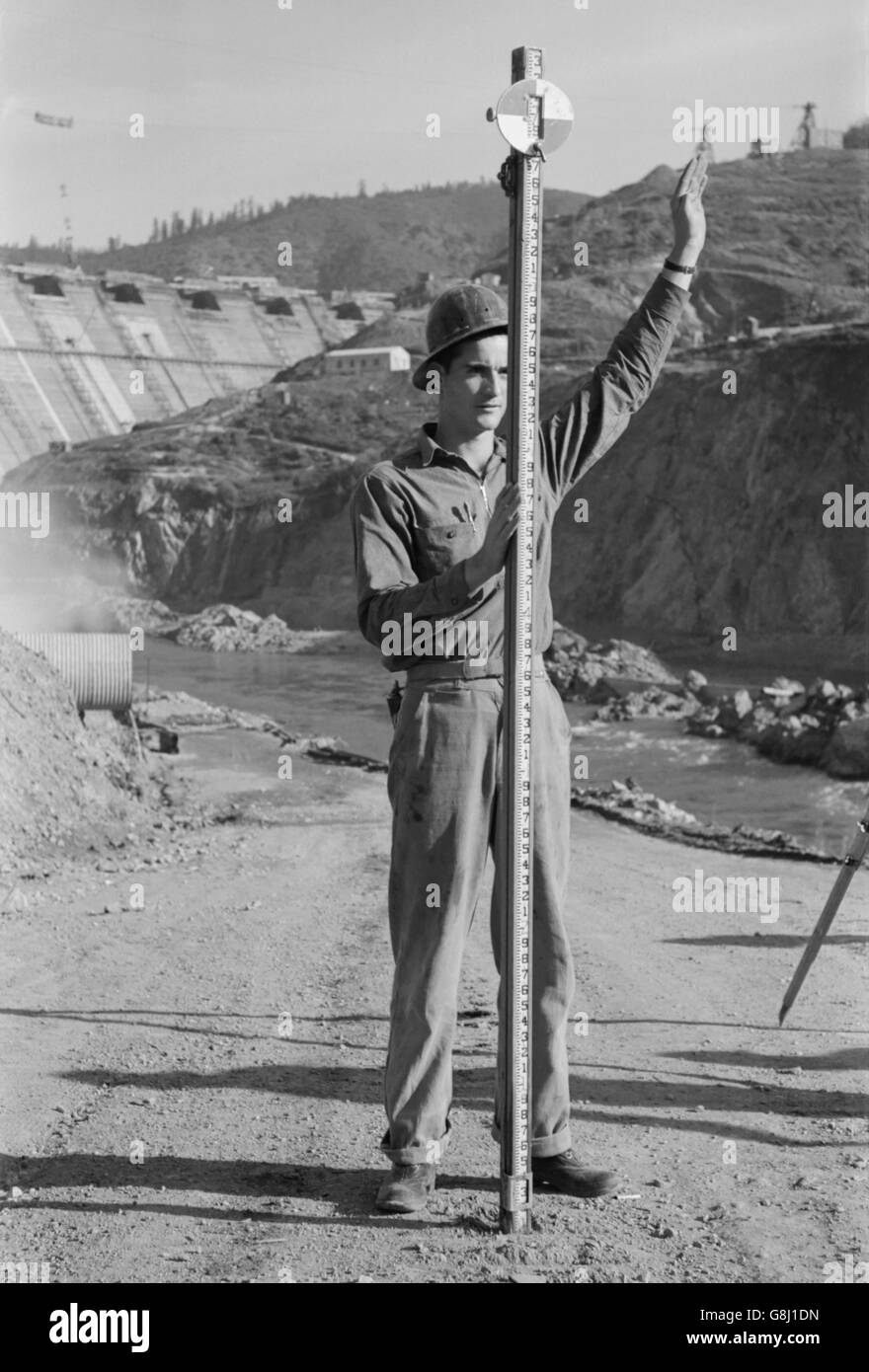 Rod Man with Surveying Crew, Shasta Dam, Shasta County, California, USA, Russell Lee, December 1941 Stock Photo