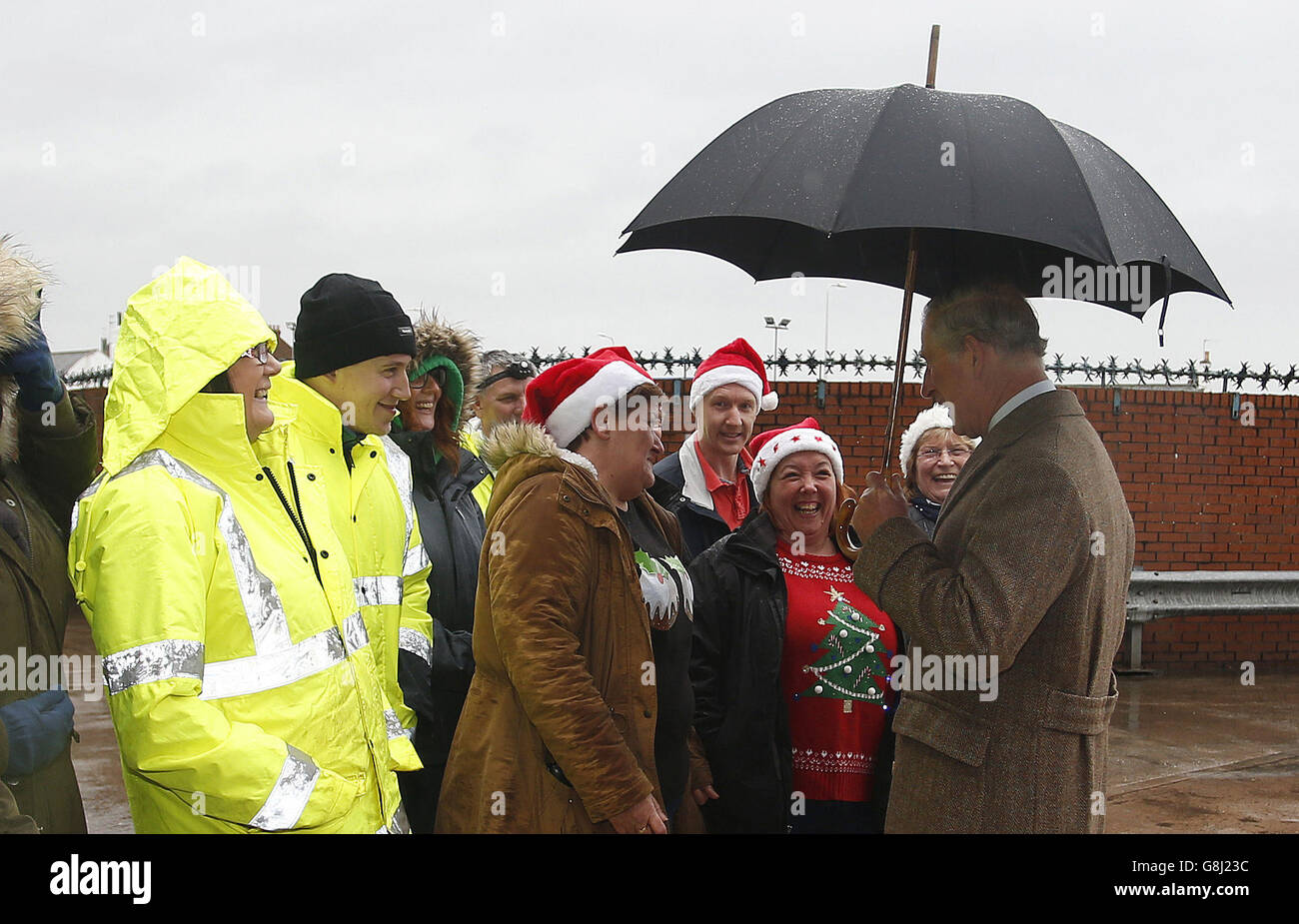 The Prince of Wales talks to well wishers during a visit to the McVitie's factory in Carlisle, which was damaged in the floods earlier in the month. Stock Photo