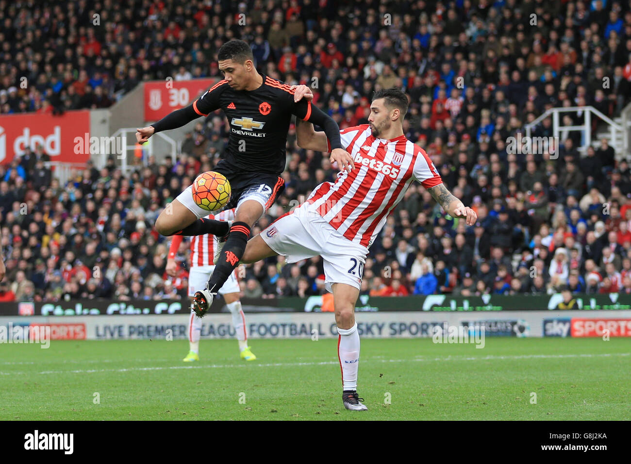 Manchester United's Chris Smalling and Stoke City's Geoff Cameron ...