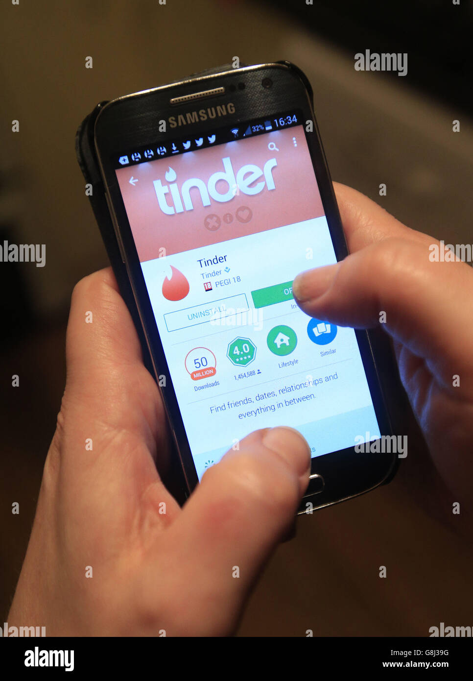 Dating app stock. The Tinder app in use on a Samsung smartphone. Stock Photo