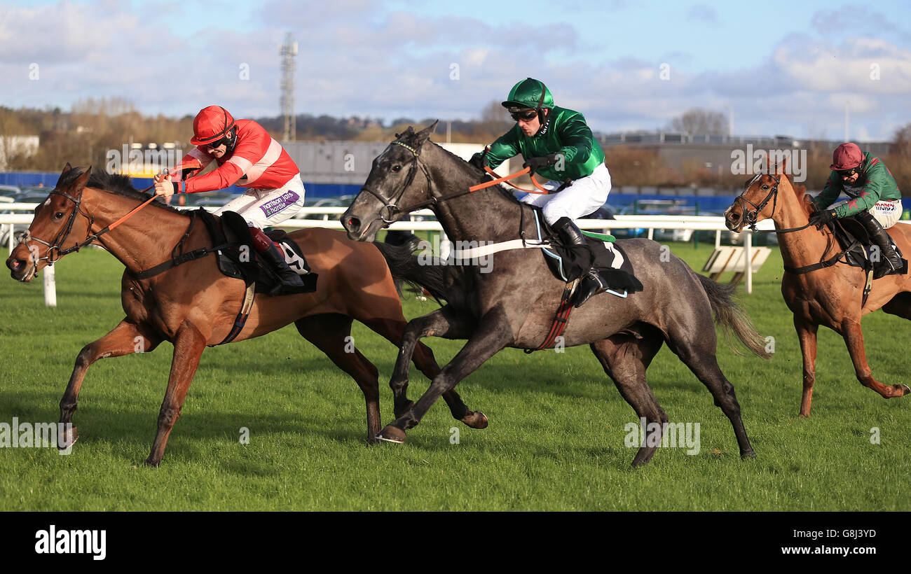 Fixe Le Kap (right) ridden by Jeremiah McGrath jumps the last fence to win the Betfred Mobile Juvenile Hurdle Race ahead of Tommy Silver ridden by Sam Twiston-Davies during the Betfred Challow Hurdle Day at Newbury Raceocurse, Newbury. Stock Photo