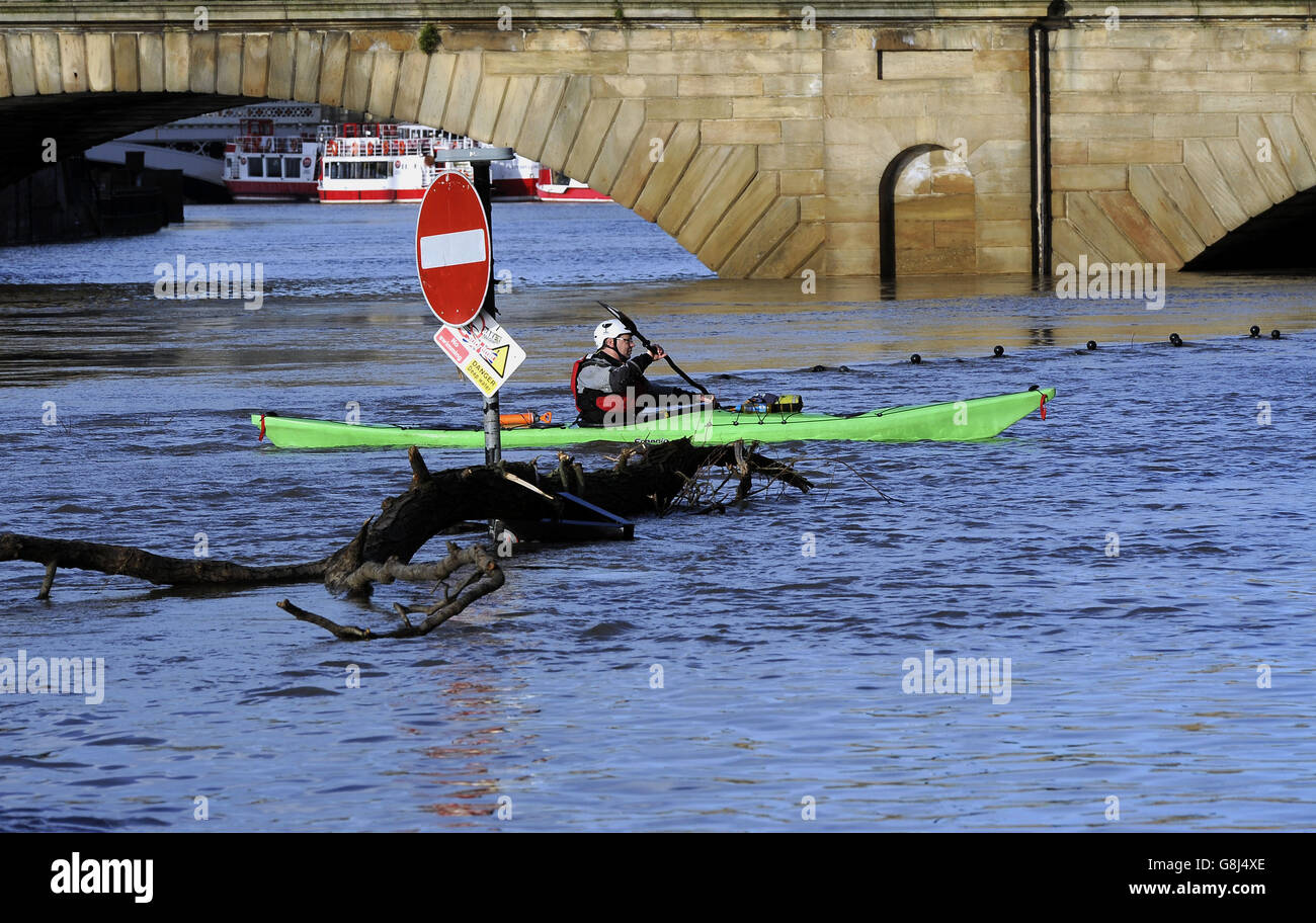 People use canoes in York as levels on the River Ouse remain high after recent severe flooding in the city centre. Stock Photo