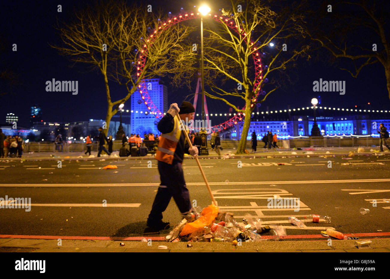 The clean-up begins in central London after the New Year celebration ...