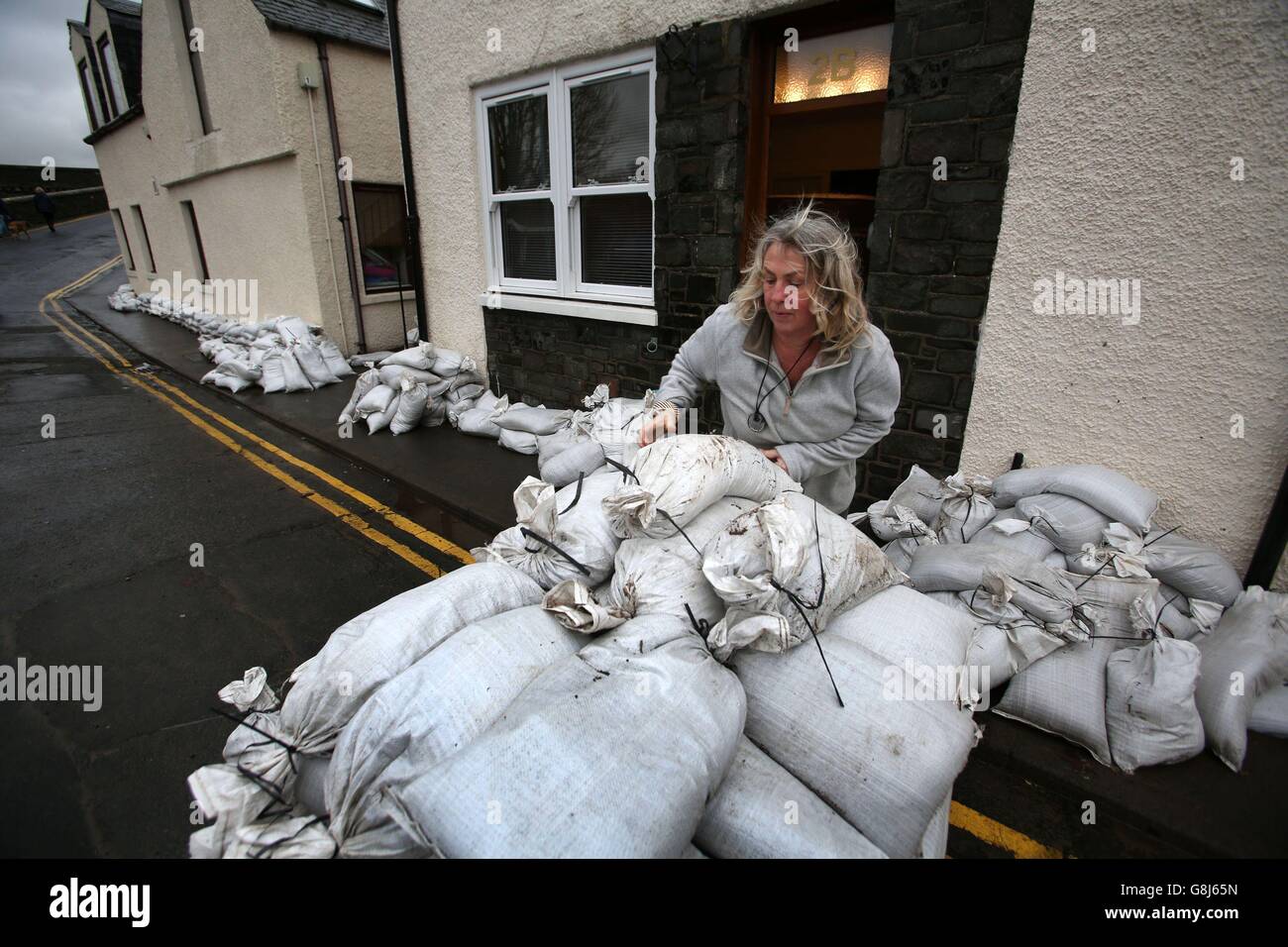 Locals in Peebles in the Scottish Borders, begin clearing up following Storm Frank, as forecasters issued a fresh warning for more persistent rain over the weekend. Stock Photo