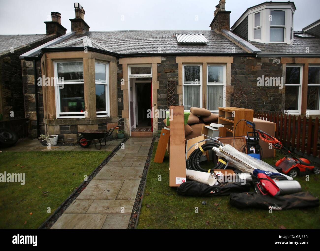 Belongings outside a property in Peebles in the Scottish Borders, begin clearing up following Storm Frank, as forecasters issued a fresh warning for more persistent rain over the weekend. Stock Photo
