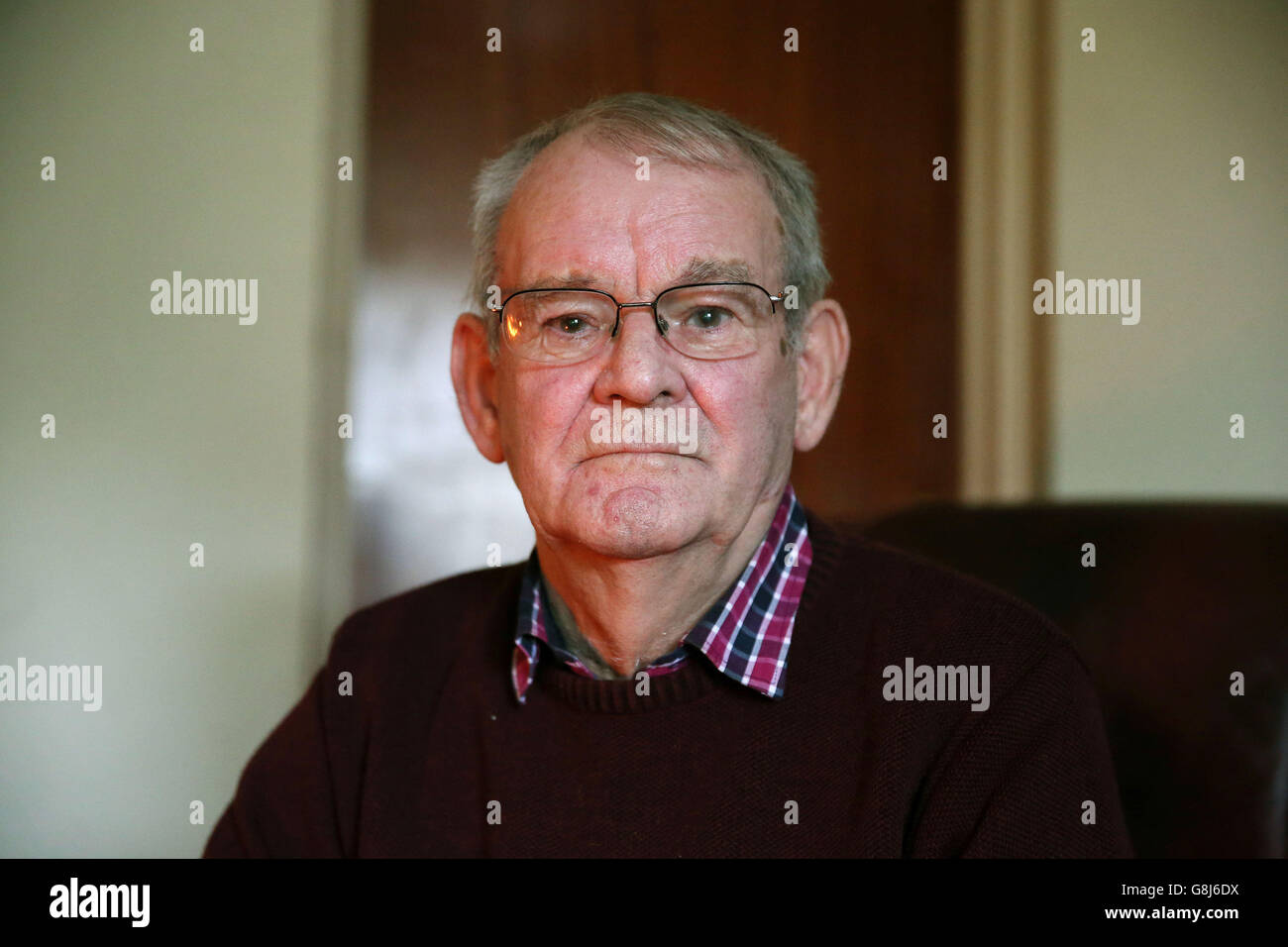 Kingsmill survivor Alan Black with his dog Libby at his home in Bessbrook, Co. Armagh, who has said that the slaughter of 10 Protestant workmen in Northern Ireland exactly 40 years ago should never be forgotten. Stock Photo