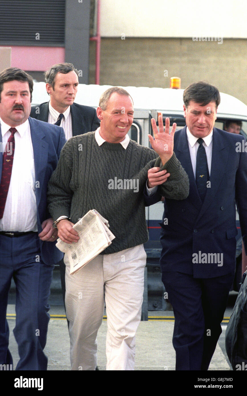 26million Brink's-Mat gold bullion robbery, was flown back to Britain from Spain with two Scotland Yard detectives. He is now expected to face charges concerning the movement of money after the raid near Heathrow in 1983. Stock Photo