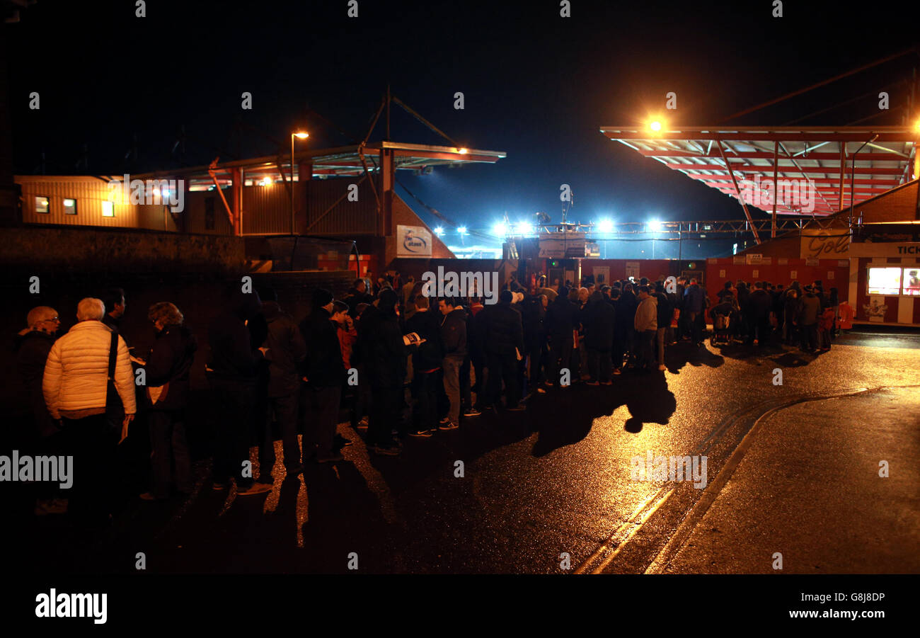 Supporters queue up outside the ground ahead of the Emirates FA Cup, third round match at St James Park, Exeter. Stock Photo