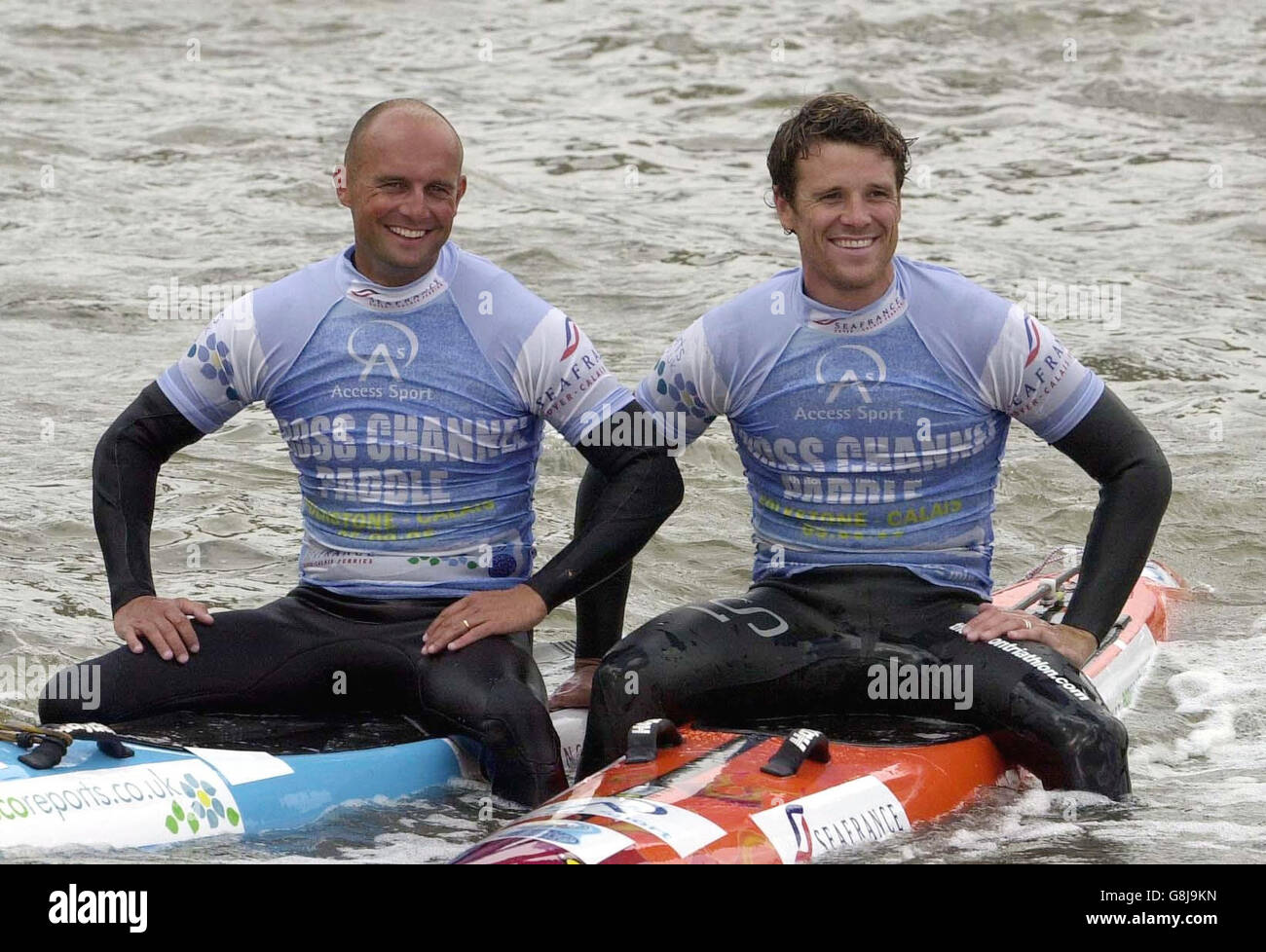 Olympic rower James Cracknell and surf coach Pete Craske, left, pose on