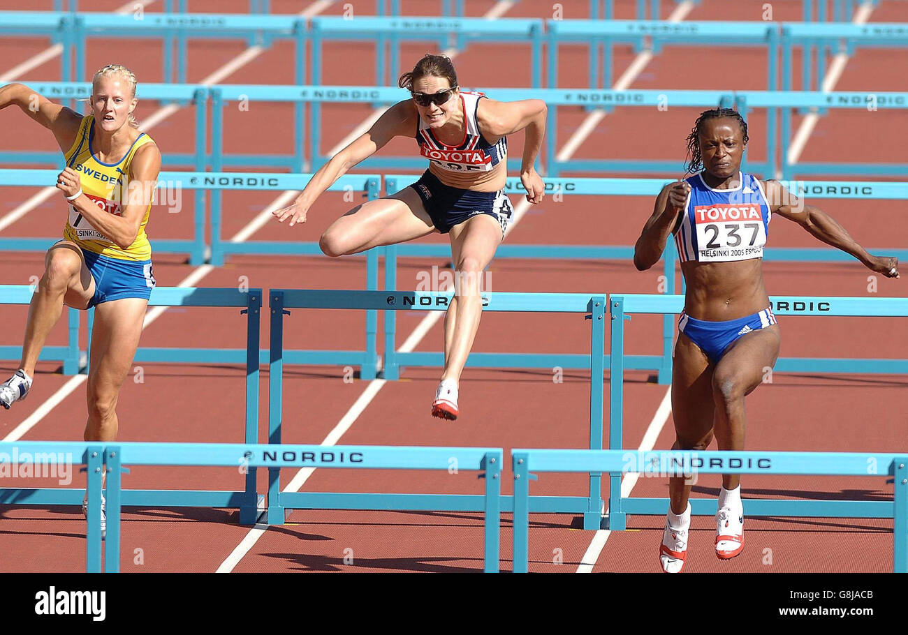 Great Britain's Kelly Sotherton (C) finishes third to France's Eunice Barber (R) and Sweden's Carolina Kluft in the 100m hurdles of the Womens Heptathlon. Stock Photo