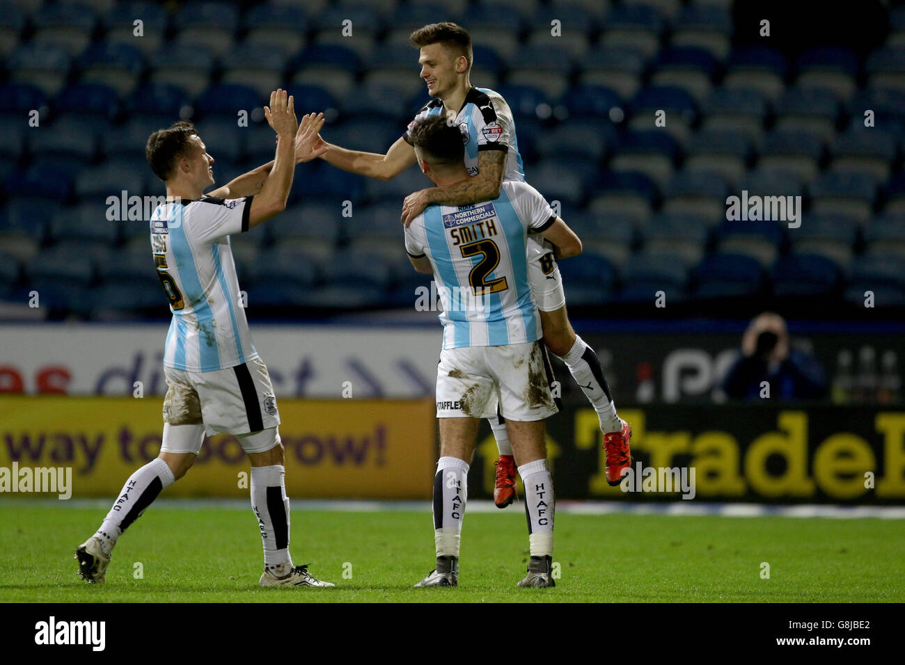 Huddersfield Town's Jamie Paterson is lifted in tha air by Huddersfield Town's Tommy Smith and Huddersfield Town's Jonathan Hogg after scoring the 3rd goal Stock Photo