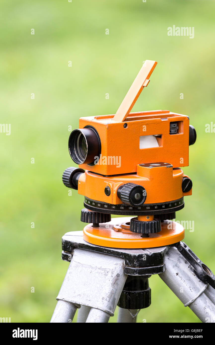 Measurement instrument (theodolite level tool) mounted on tripod Stock