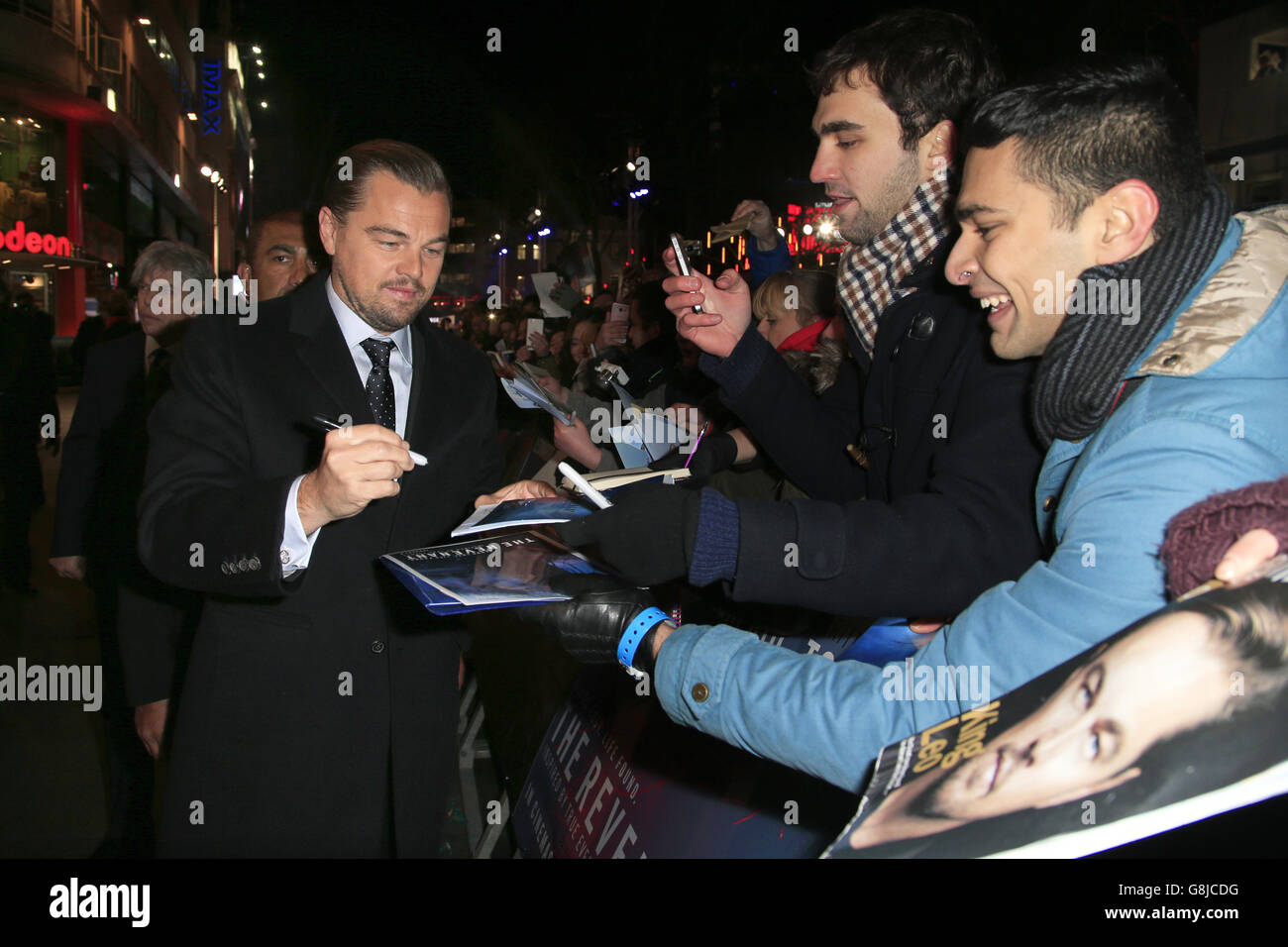 Leonardo DiCaprio signs autographs as he arrives for The Revenant premiere, held at Empire Leicester Square, London. PRESS ASSOCIATION Photo. Picture date: Thursday January 14, 2016. See PA story SHOWBIZ Revenant. Photo credit should read: Jonathan Brady/PA Wire Stock Photo