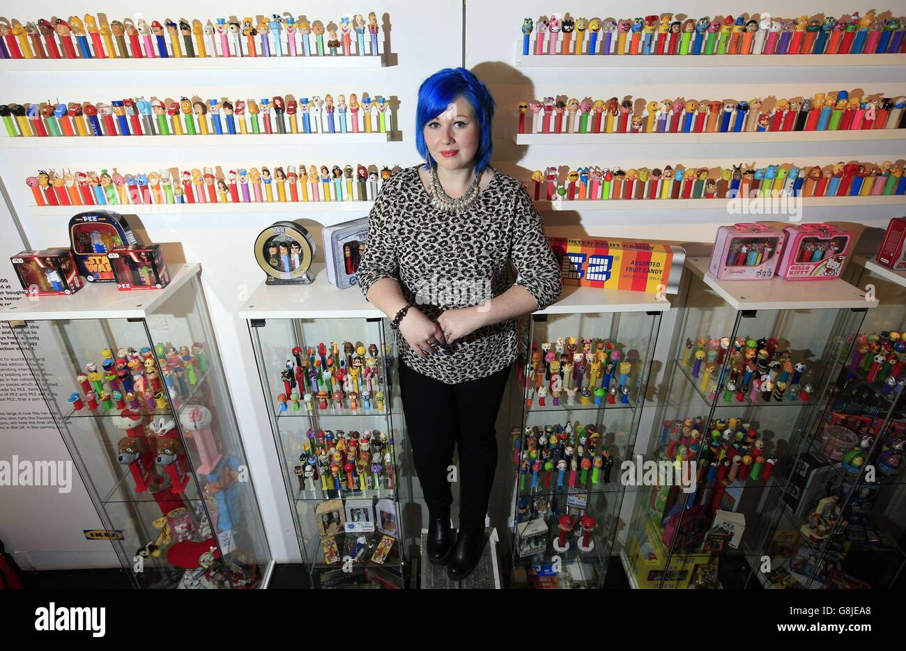 Kelle Blythe, from Norfolk, stands amongst her three thousand strong collection of Pez candy dispensers at a pop up exhibition of Britain's eleven 'most obsessive' collectors at the Proud Archivist, London. Stock Photo
