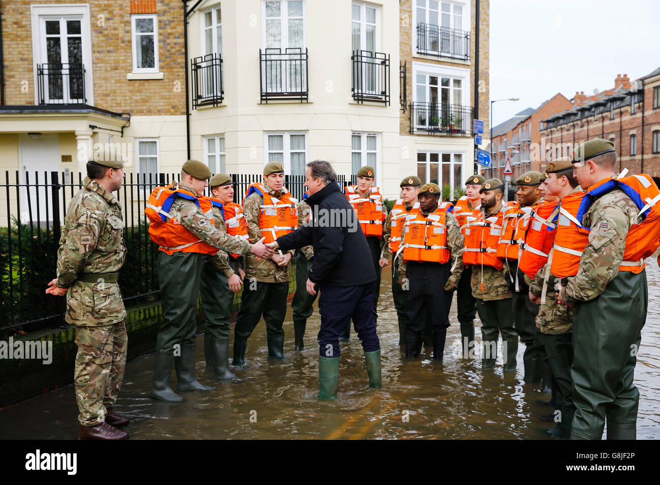 Prime Minister David Cameron greets soldiers working on flood relief in York city centre after the river Ouse burst its banks, in North Yorkshire. Stock Photo