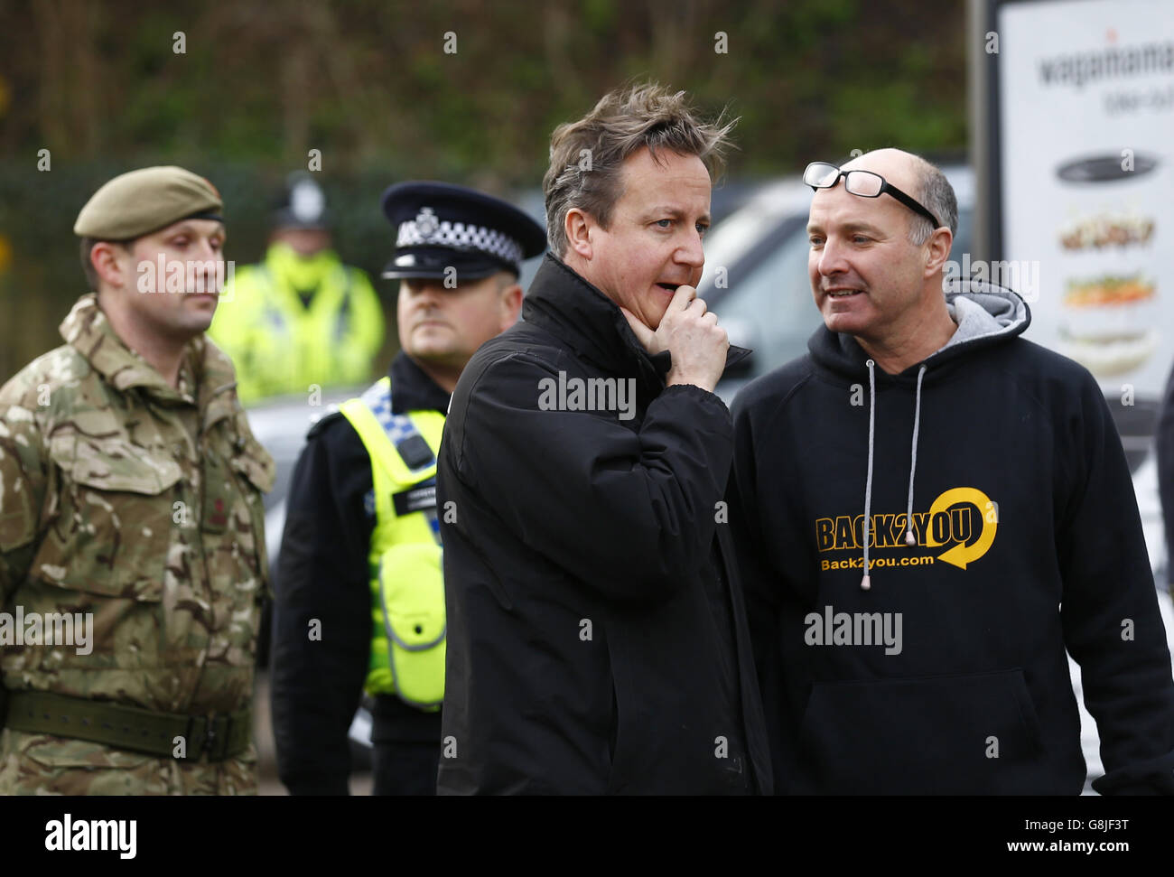 Prime Minister David Cameron talks to a resident in York, after it was flooded in North Yorkshire. Stock Photo