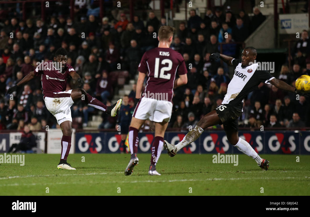 Heart of Midlothian's Prince Buaben (left) scores his side's second goal of the game during the Ladbrokes Scottish Premiership match at Tynecastle Stadium, Edinburgh. Stock Photo
